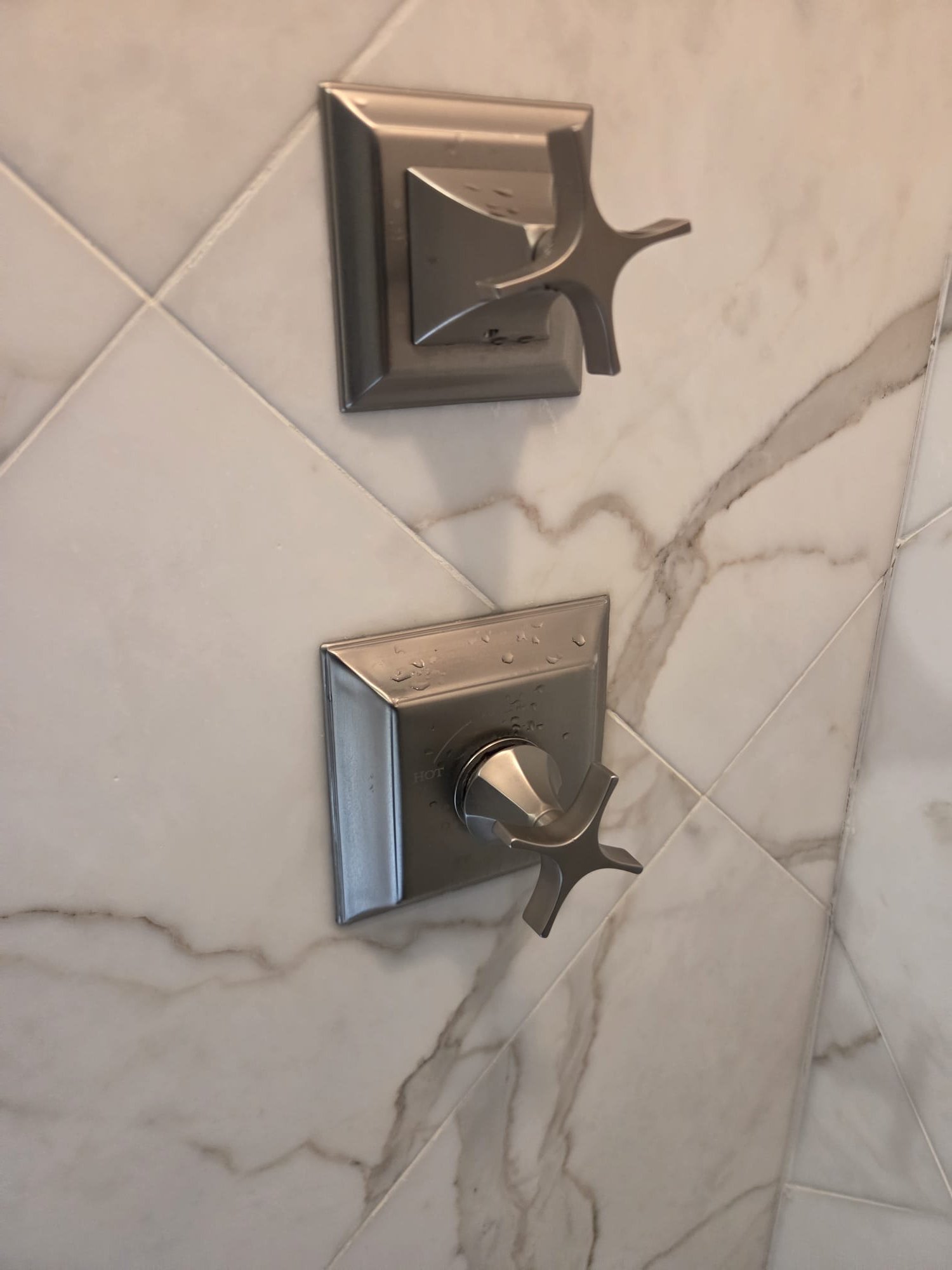 Call for leaking shower head.

Arrived and met with Ms. Kathy. She states that the shower head has been dripping.  Mr. Bird is able to stop the drip when turning it on fully,  then shutting it off. 

Inspection and observations:
Shower is in the master bathroom.  It appears to be from the kohler memoirs stately collection. Can replicate leak. Calcium and magnesium build up noted at shower head.  

Checked water pressure.  An old gauge was on the mainline, but wasnt working. Tested at eater heater and found fluxtuons. Highest reading exceeded 80psi at 88psi. Pressure regulating valve manufactured early 2002.  Waterline has had repair done o. It. Main line going out if the basement towards meter is galvanized. It transitions briefly to PVC, then to copper. Line splits in main house badement (presumably to feed pool/guest house). 1 inch mainline splits to 3/4 for main house,  one inch to back. Water heaters are from May of 2024. Thermal expansion tank bladder intact. Recirc pump on these 