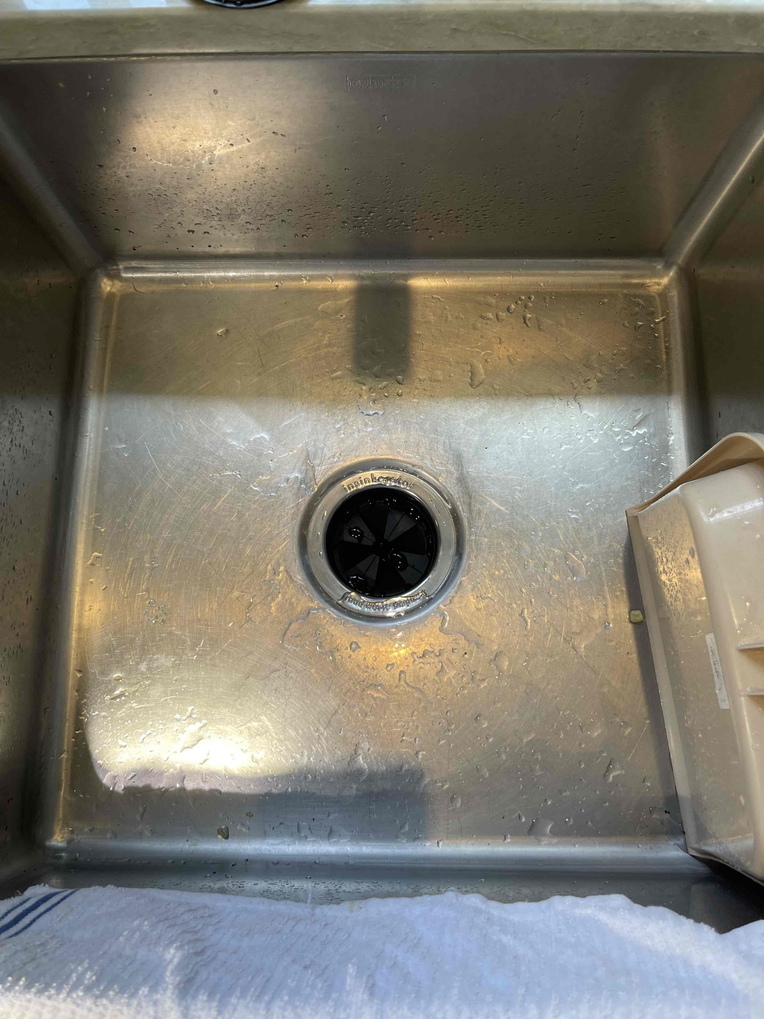 Came out for a garbage disposal that fell inside the cabinet. It was not the same disposal another technician installed. This was the secondary disposal on the side sink. The stainless compression band gave out and the disposal fell, snapping the waste arm off inside the disposal. We received approval to replace. Went and purchased a new 3/4 hp disposal and installed. Tested to ensure proper function and a leak free installation. 