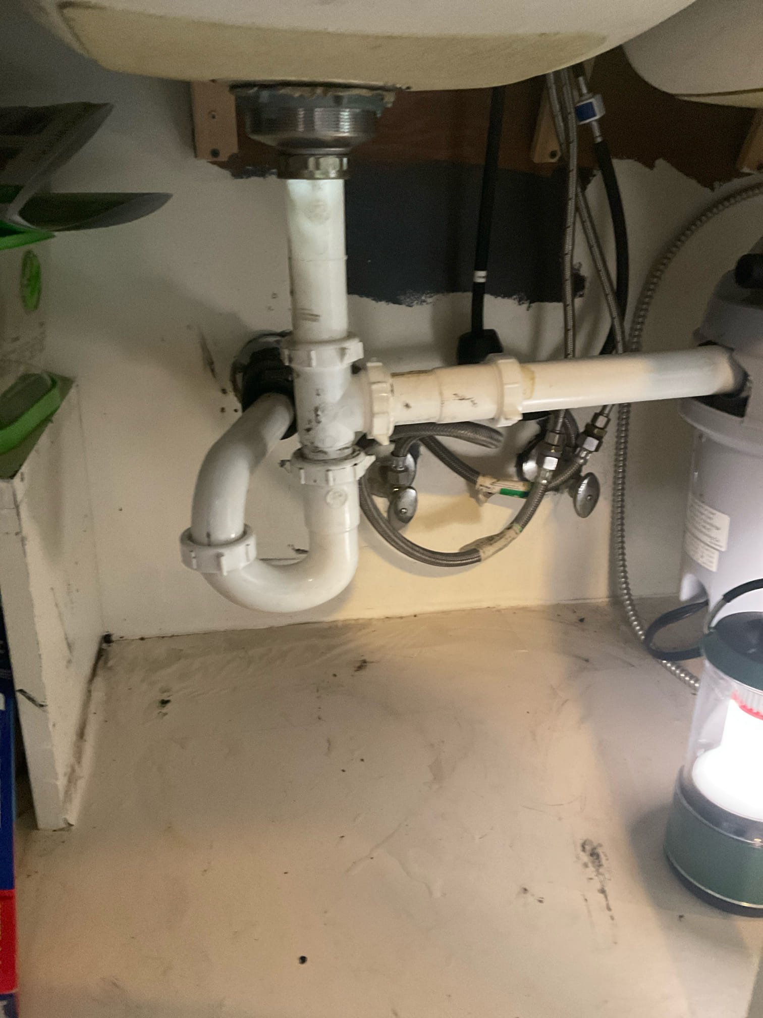 Customer stated that there was a leak under the kitchen sink and also that kitchen sink was backing up. Stated to customer that we need to rework piping under kitchen sink and also run snake to attempt to clear stoppage and customer agreed. Went ahead and attempted to run snake from underneath kitchen sink and also from vent on roof. Wasn’t successful on getting kitchen line opened up. Went ahead and replaced piping under kitchen sink to take care of leak issue. Gave customer options as far as next steps to get the kitchen sink back up and flowing and customer agreed to have kitchen line jetted. Will return Monday morning to jet kitchen line. Cleaned up work area.
