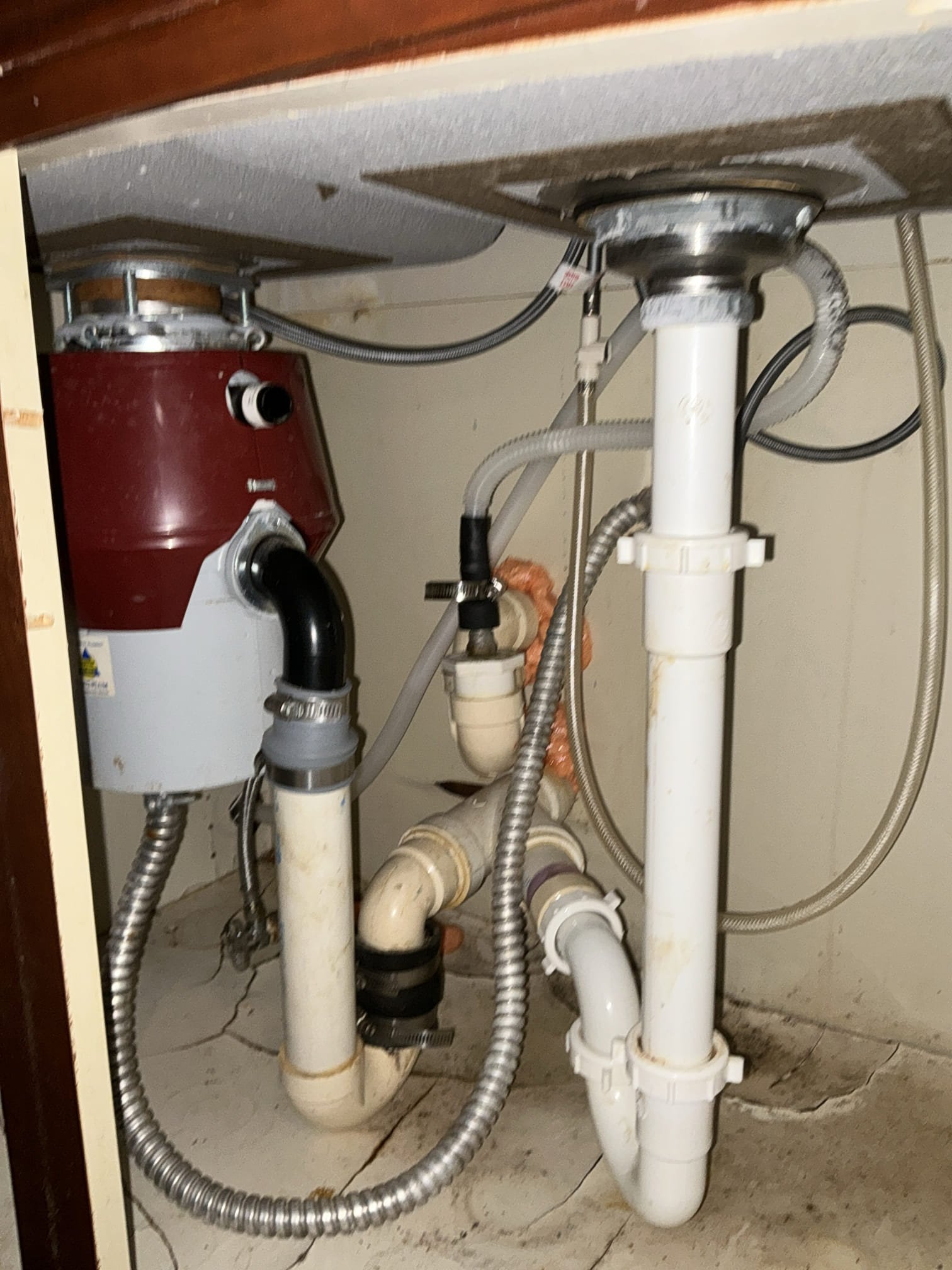 Diagnosed leak at kitchen faucet. Found kitchen faucet sprayer leaking heavily in cabinet below. Customer would like to install new drop in sink and faucet as well as new disposal. Left estimates 