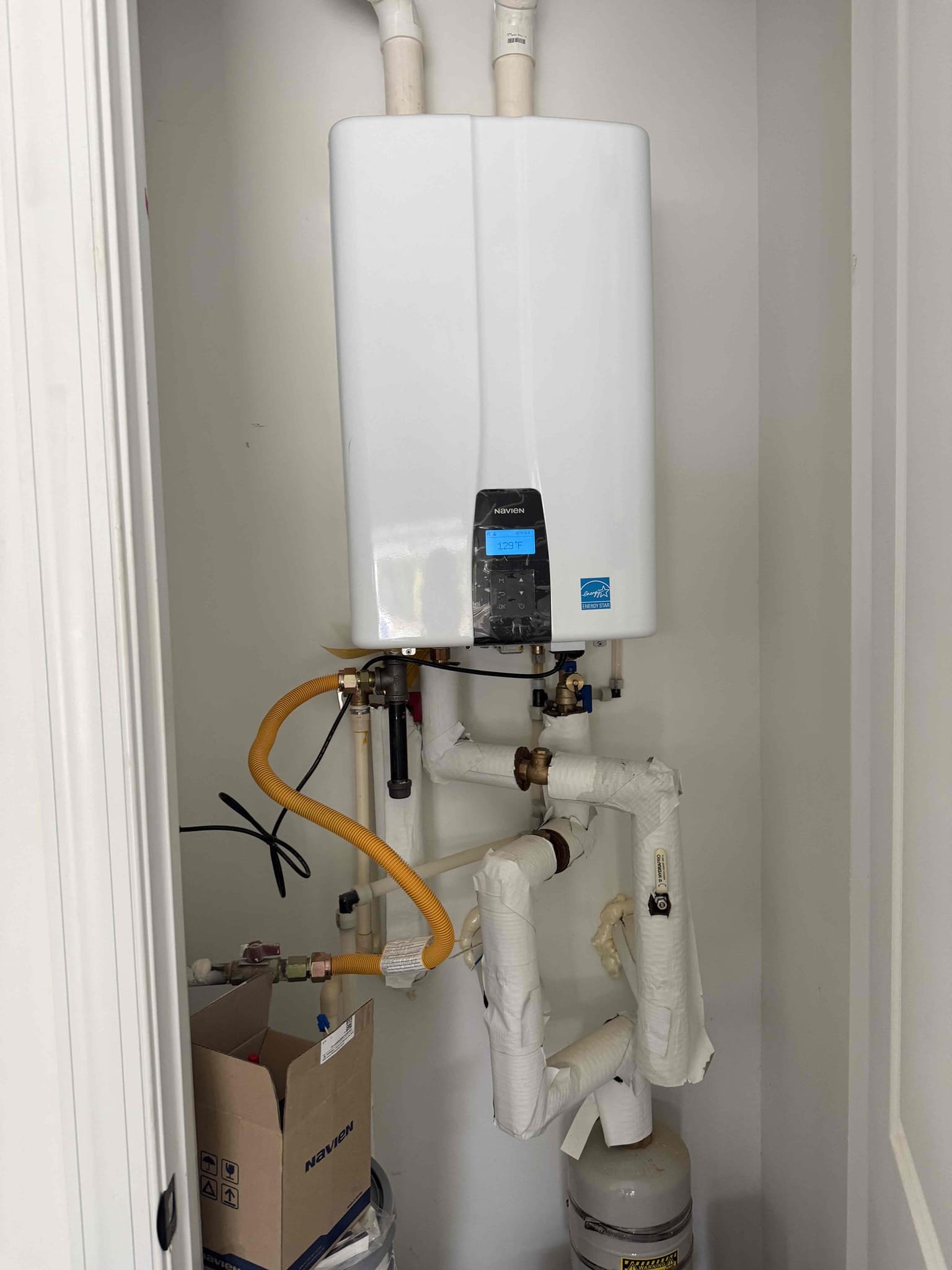 Navien tankless not producing hot water upon arrival. Customer stated he had another plumber out yesterday and they told him it was the recirculating pump that failed. After talking to navien tech support they sent the customer a flow sensor as well as a check valve. Pulled flow sensor and cleaned debris out of the sensor. Navien is now producing hot water properly. Informed customer if it goes out again we will need to replace the check valve and flow sensor. 