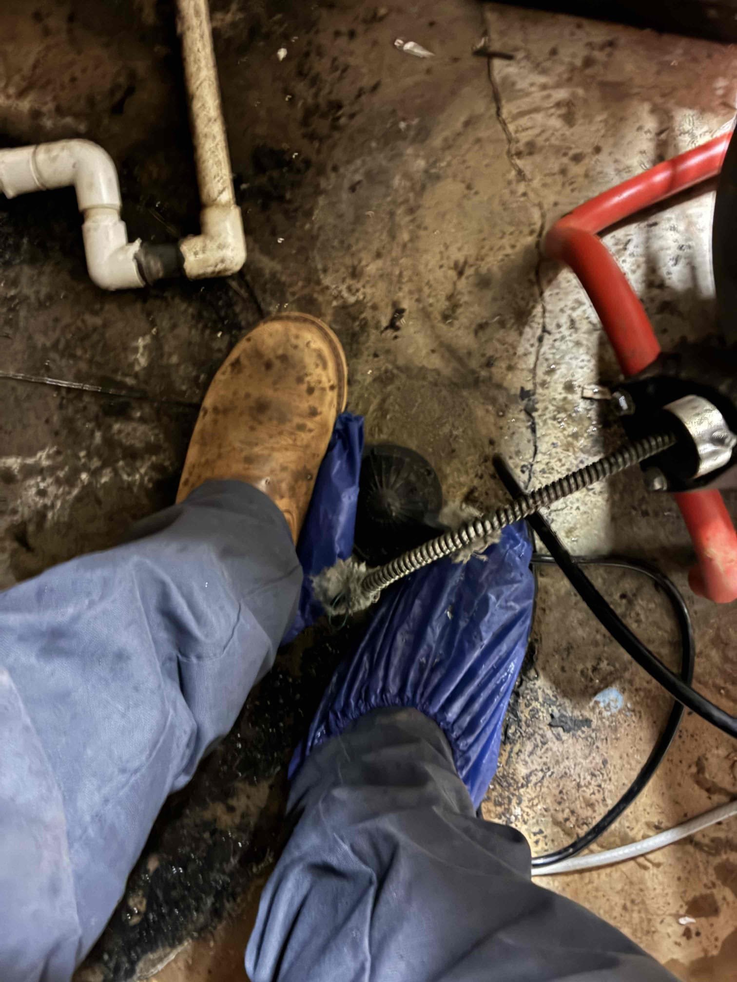 Found basement kitchen sink drain clogged. Removed discontinued 3/4 hvac drain into 2” kitchen sink drain in mechanical room behind kitchen. Kitchen drain is abs above slab and cast iron in slab. Ran sewer cable into drain to clear blockage. Cleared blockage at about 35’ a ran about 30+’ more cable. Ran kitchen sink to test left in good working order.