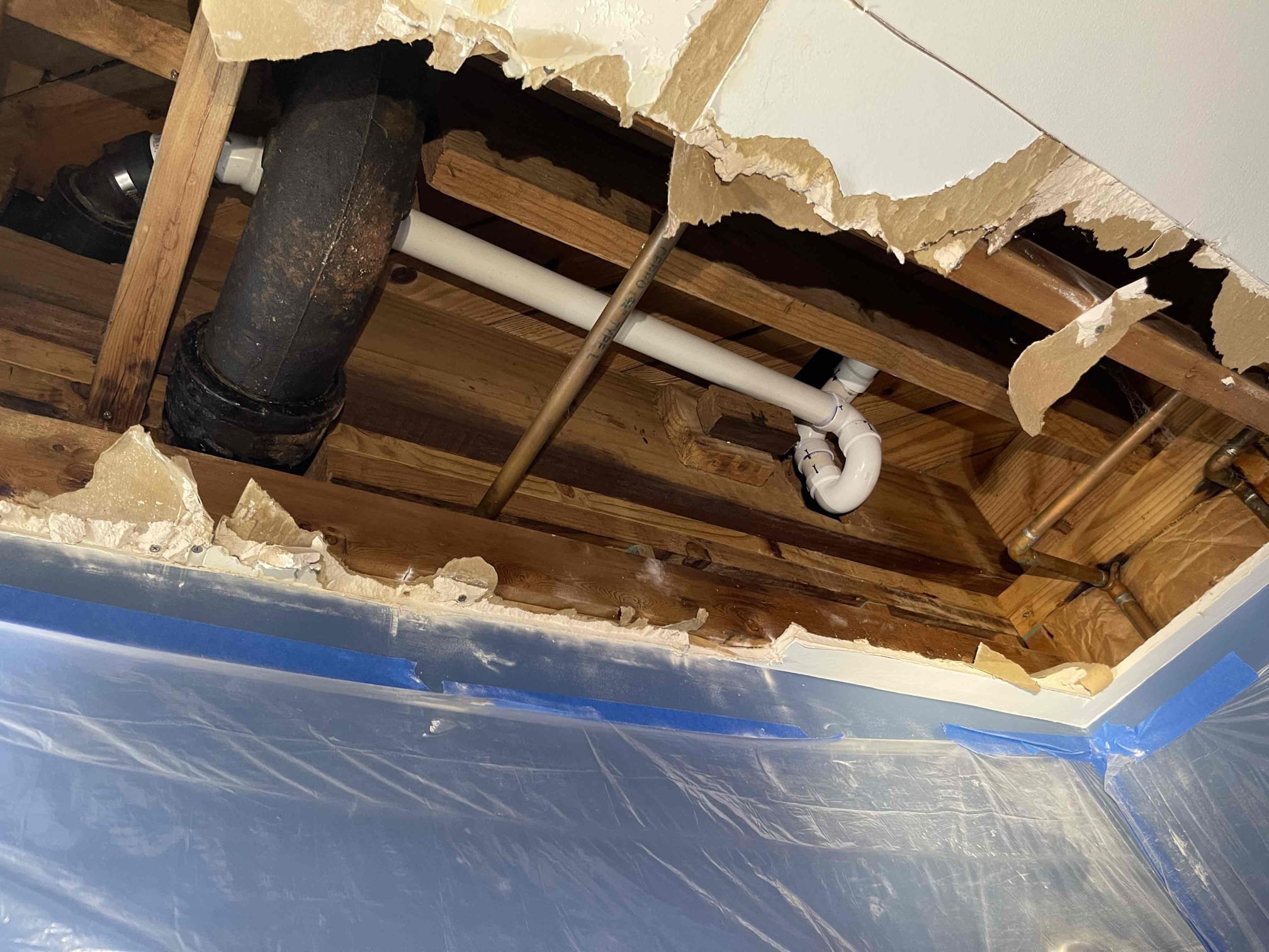 Came out to replace tub drain. We tarped off the downstairs bathroom with plastic. Cut open the ceiling where necessary. Cut out the waste and overflow, p trap, and approx 4’ of 2” cast iron. Replaced with pvc and tested to ensure proper drainage and a leak free install. We took the brass waste and overflow apart and found a red plastic cap stuck inside the drain. I believe this cap was flipping back and forth inside the drain when we would snake it and was causing the tub to have problems draining. Customer also mentioned while we were here that the downstairs toilet gurgled really badly randomly a couple days prior while they were doing laundry. We camera’d the mainline from the outside cleanout and found that there is a section of the cast iron pipe that has rotted out on the bottom side, and caused a dam of build up on the downstream side, that is causing the pipe to hold water in this section. I believe they had a partial blockage occur in that section of the drain as it is at the