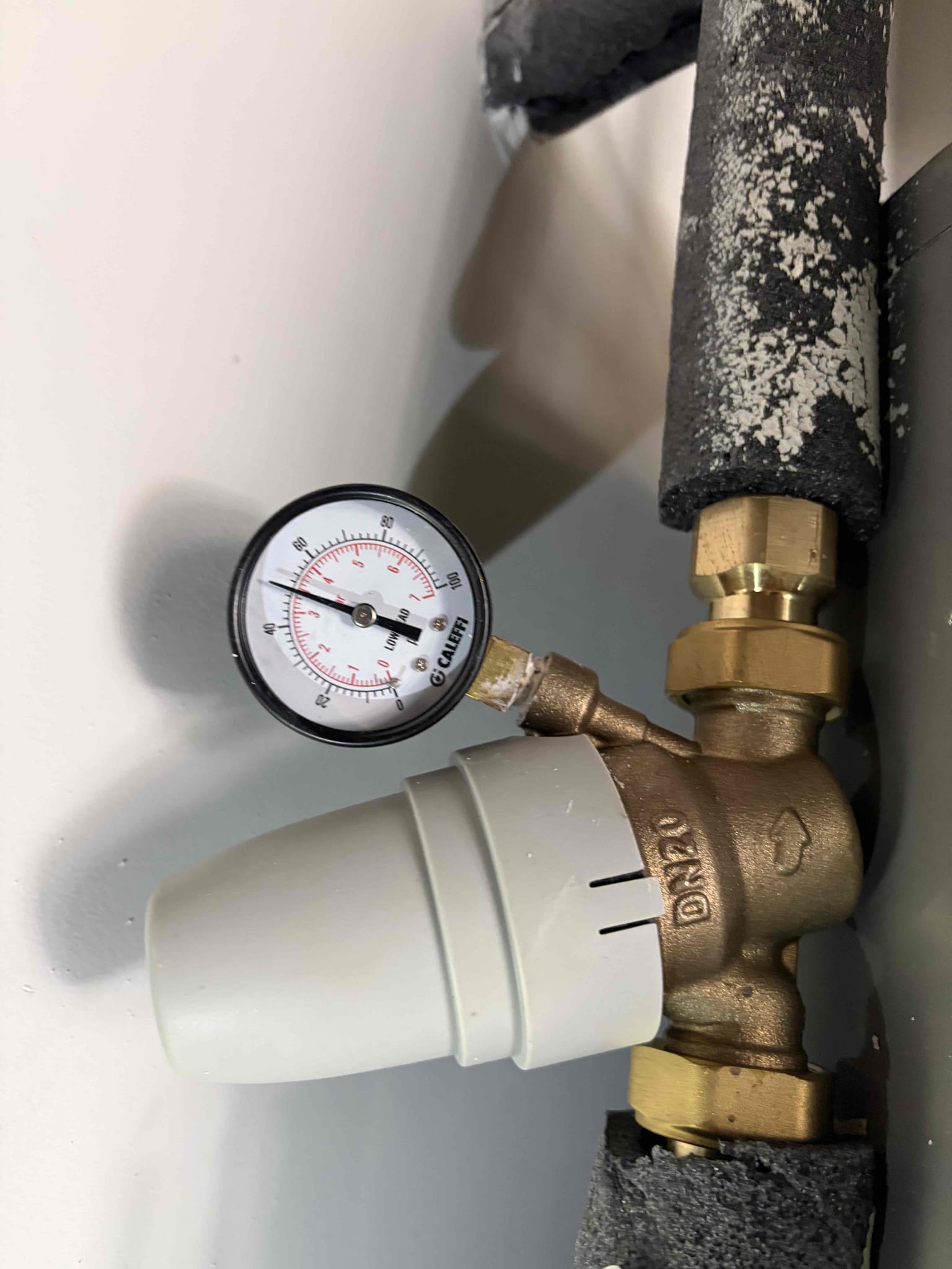 Repair 1/2 - 3/4 gas line behind range 
Cut drywall to access pipes

For this job, the customer called us out due to a leak behind the gas range. It was a gas leak, unsure of where it was coming from. However, I had detected that it was coming from one spot and I had disconnected everything that I saw it was a problem removed all the Teflon tape from the fittings however I went back with a new 3 inch nipple on a 3 inch 90 tight back together Pressurize the system and the meter was still going off along with the bubbles so I opened up the drywall to figure out where the second leak was coming from, and the second leak was coming from a three-quarter inch nipple however, this nipple went all the way up to the ceiling And went to the attic I assume so, therefore rather than twisting the nipple all the way up and cutting the drywall I recommended to mega press the connection so therefore cut the pipe too cleaned to burred the fitting. In mega pressed a slip coupling on to the pipe once it 