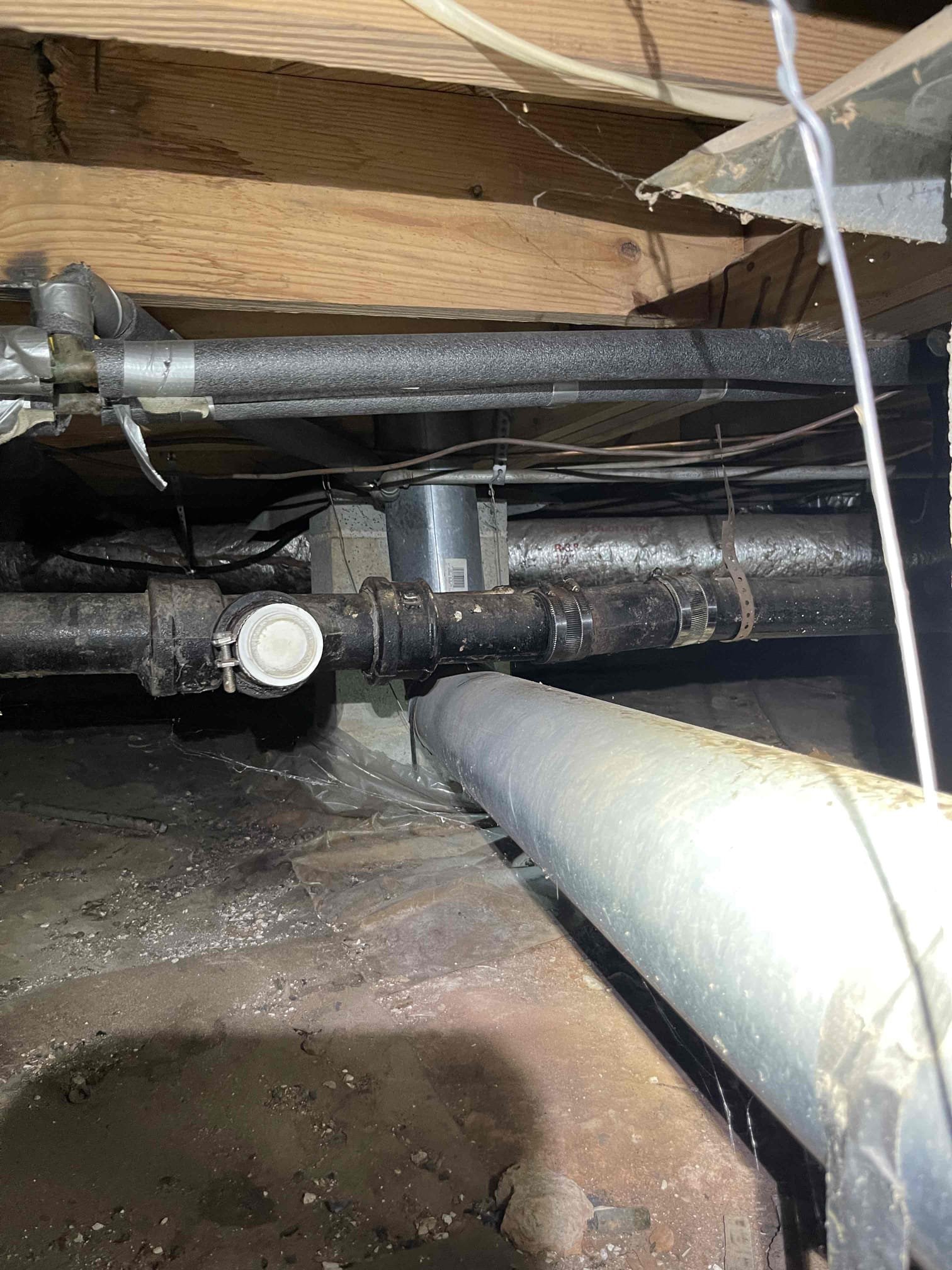 Came out for low water pressure at the kitchen faucet. Arrived and met with home owner. She demonstrated the side sprayer had regular pressure, but her regular faucet had low pressure. She also mentioned disposal was old and that the sink was slow to drain. We went down to the crawlspace and checked the water pressure and discovered that water pressure was actually too high at 85 psi. We inspected the drain line to the kitchen and found it was original cast iron with rusted nodules and back pitched sections. Notified customer of our findings and she elected to replace the faucet, disposal, PRV, front hose bib and stop valves for kitchen sink. Customer is planning to have drain line replaced when she returns from vacation. We preformed all work as quoted and the only new finding was that then main water line was energized with electricity. Electricity could only be felt when a section of pipe was cut off from ground. Customer is aware that kitchen sink is still slow to drain this time, 