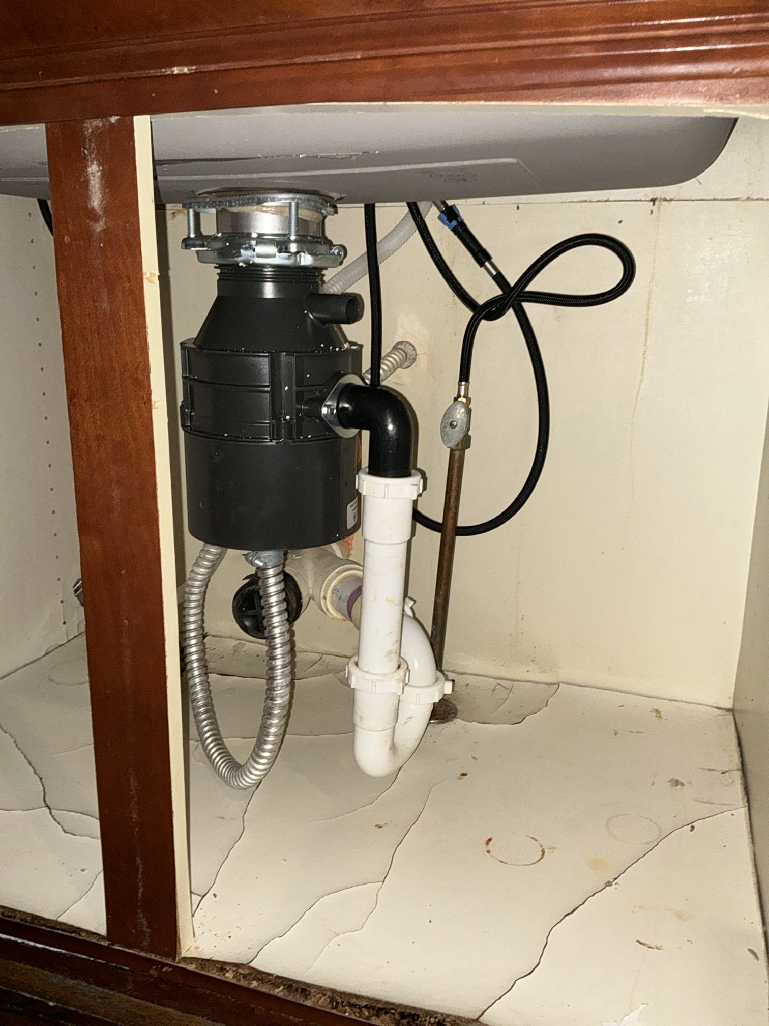 Shut off water to faucet. Remove old leaking kitchen faucet. Install new customer supplied drop in sink with new kitchen faucet. Install new disposal supplied by Chen. Install all fixtures and seal properly. Test all work for proper operation. Clean workspace 