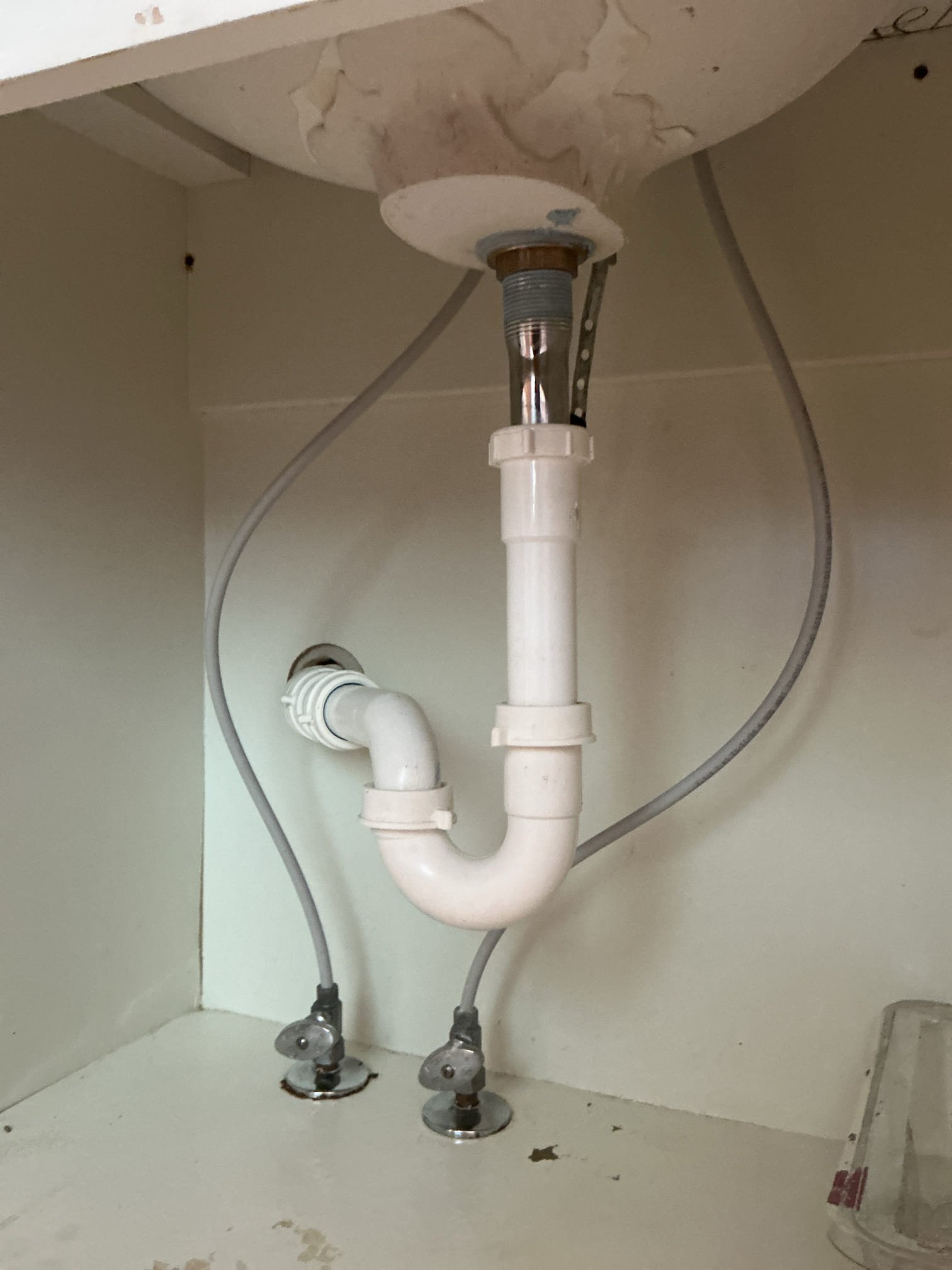 Diagnosed lavatory leaking into cabinet below. Found pop up assembly missing connection rod causing water to leak out of rod hole in cabinet below. Disassembled Ptrap and removed old pop up assembly. Installed new push pop up assembly and reassembled trap. Tested new pop up for proper operation and no leaks found after work completed. Cleaned workspace