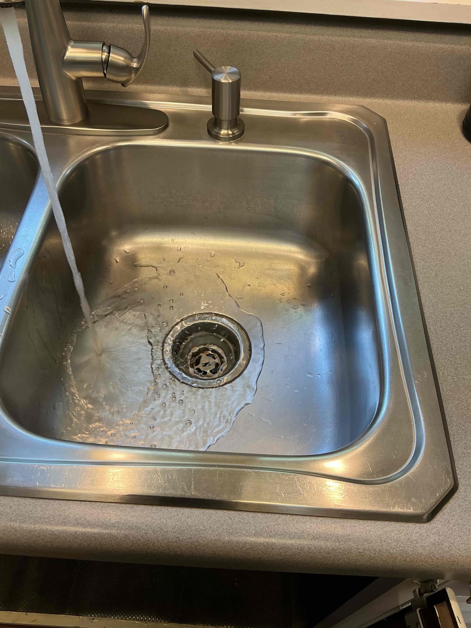 Customer had drain issues within kitchen sink. Ran small machine to clear drain. Ran water after to check for proper drainage function. 