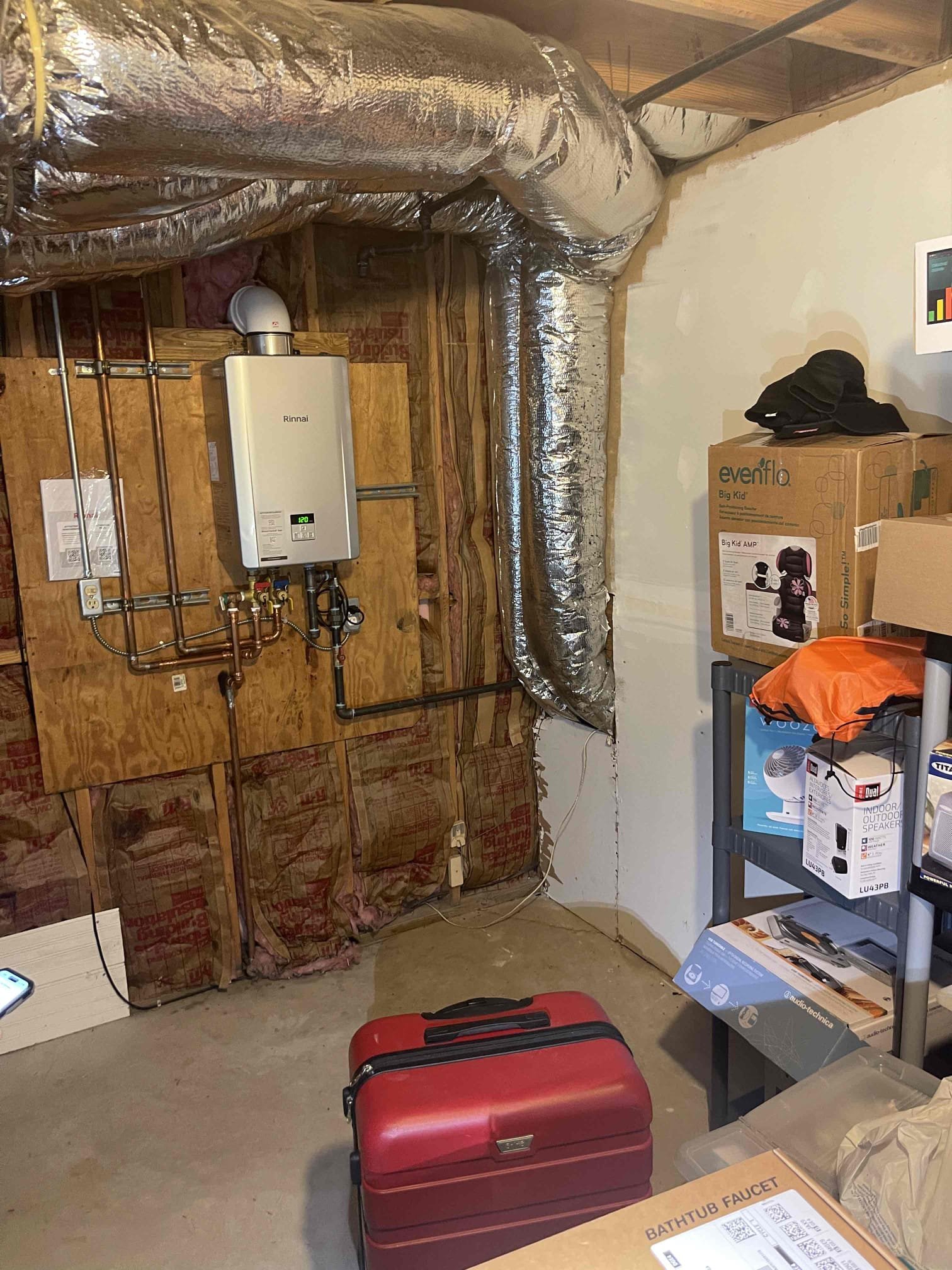 Install customer supplied utility sink and faucet, route copper waterlines with isolation valves to sink. Install hot and cold lines with stop valves. Run 2” pvc drain across wall into crawlspace, route across crawlspace and cut in a new tie in to the 4” abs mainline in the crawlspace. Secure piping to wall. 