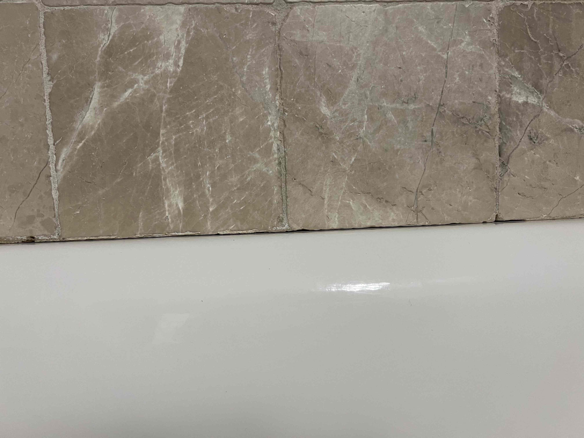 Customer had leak coming from master shower to downstairs bathroom/bedroom. Ran water in shower from different spraying options until finding that sprayer wand spraying at wall on loose eschueton. Caulked area and caulk tub for kids bath for potential leak above kitchen also looked at meter determined no leak on meter to house was unable to find meter to irrigation to further investigate Water bill leak issue. 
