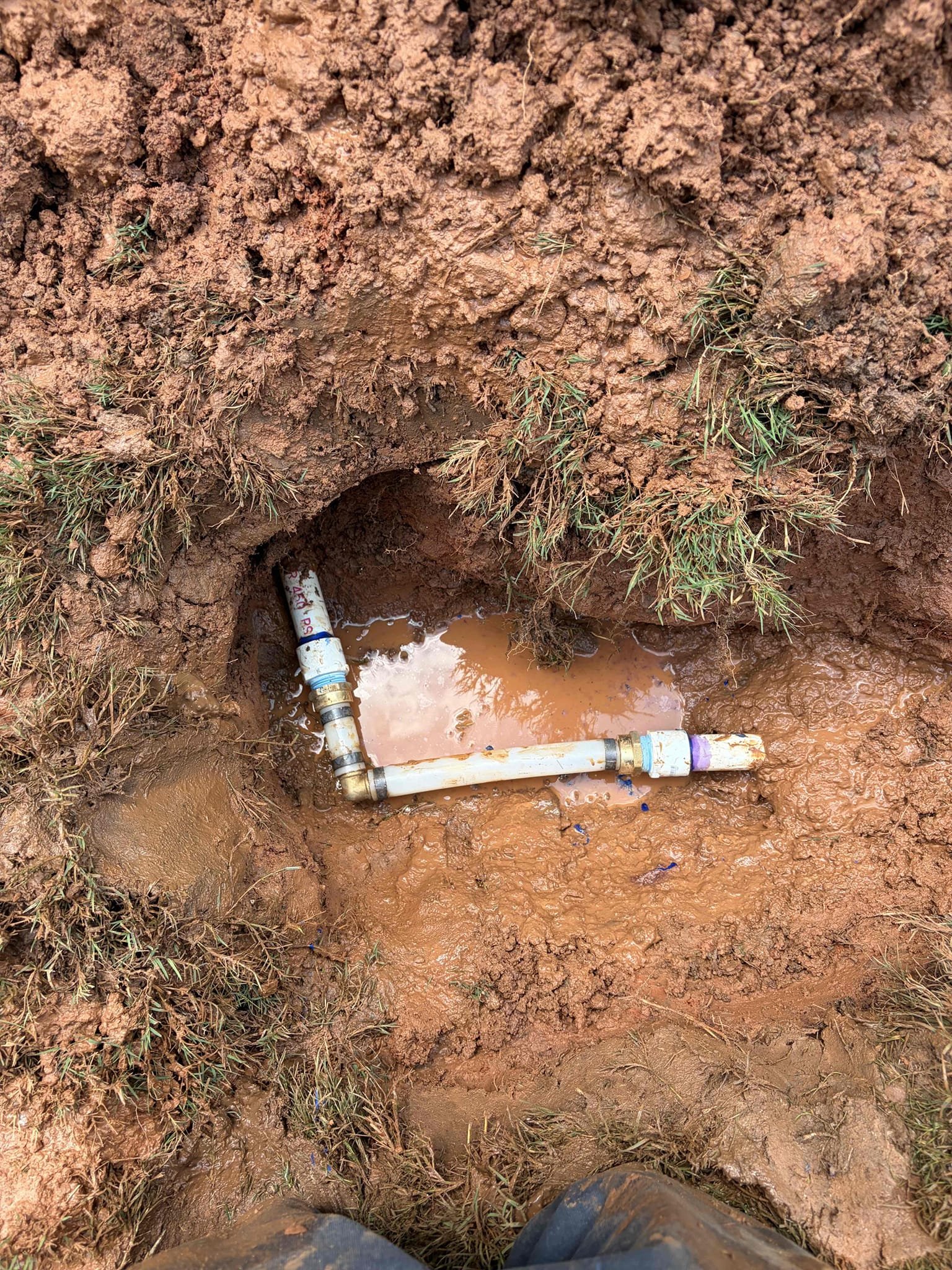 Hand dig to find a water service leak in the ground 
Repair the pipe in the ground 

For this customer, they had a main waterline leaking on the side of the hole wasn’t an irrigation line, but it was their main service line going into the home so therefore I took a look and examine the issue and recommended to try to see if we can fix it first, if not, we would have to replace it so therefore, I dug it up to figure out what was going on with the service line was able to get it fixed and repaired with new PVC transition fittings to packs and all is well if it breaks we can come back and fix it but I’m highly recommending to do a new service line due to the fact that it is old brittle PVC more than likely original to the home in addition to that the water pressure is normal and the tankless water heater is fairly new. Once the repair has been completed I put the grass back, but it is not the best due to how mushy it is and how wet repair has been made. There are zeros on the water meter 