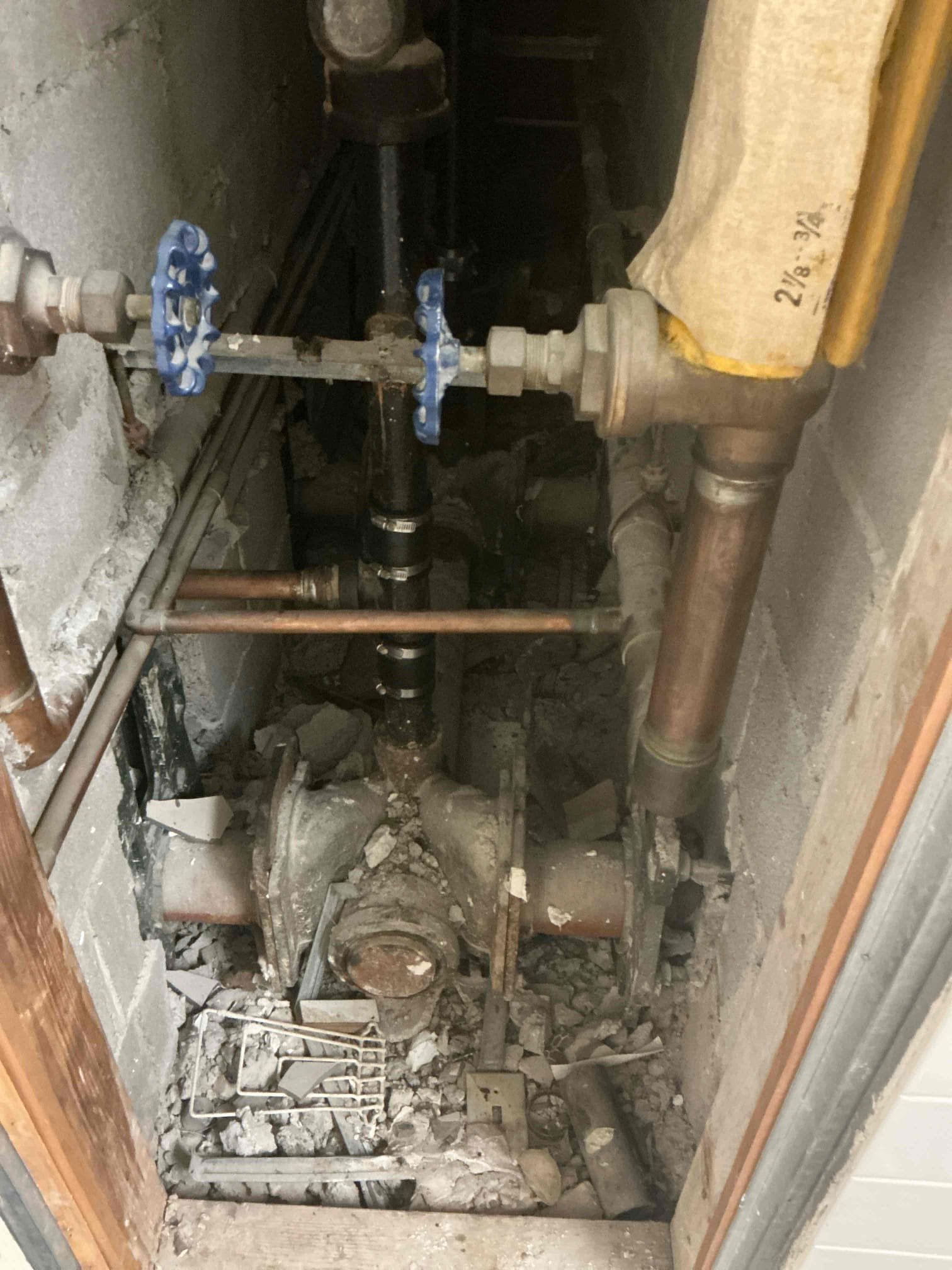 Snaked carrier drain line between the two restrooms. Pulled back feminine products. Flushed all toilets several times to test. Left in good working order.