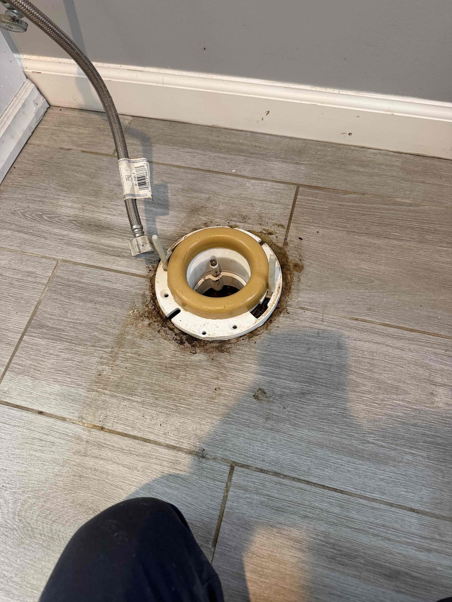 Customer stated that anytime water was used in the house. It would start leaking from under the toilet in basement. Took a look around and found that drain lines go into slab and then come out of home. Stated to customer that there is a whole house blockage and we will need to pull basement toilet and run drain cleaning equipment to attempt to clear stoppage. Went ahead and pulled toilet and ran camera. About 20 feet down the line found that blockage was made out of soft tissue so went ahead and cleared with camera. Afterwards, ran camera through whole line. Found that pipe coming right out of the house has a massive belly, which caused the back up and home. And also found that cast-iron under slab is in rough shape. Will send customer recommended repairs in order to fix backup issue. Stated to customer given the belly in the line and also the rough cast-iron blockage will occur again. Replaced flange for basement toilet and reset toilet. Tested and at this time, everything was flowing