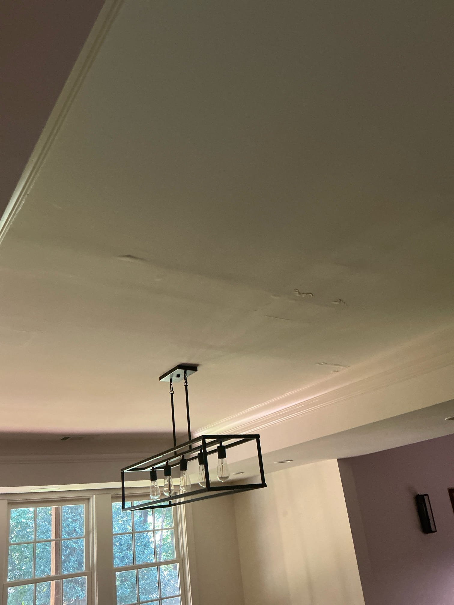 Customer had water coming through ceiling of basement. Cut three holes in ceiling looking for leak. Could not find anything leaking. Meter did not reflect any leak either. Customer will call back if anything changes.