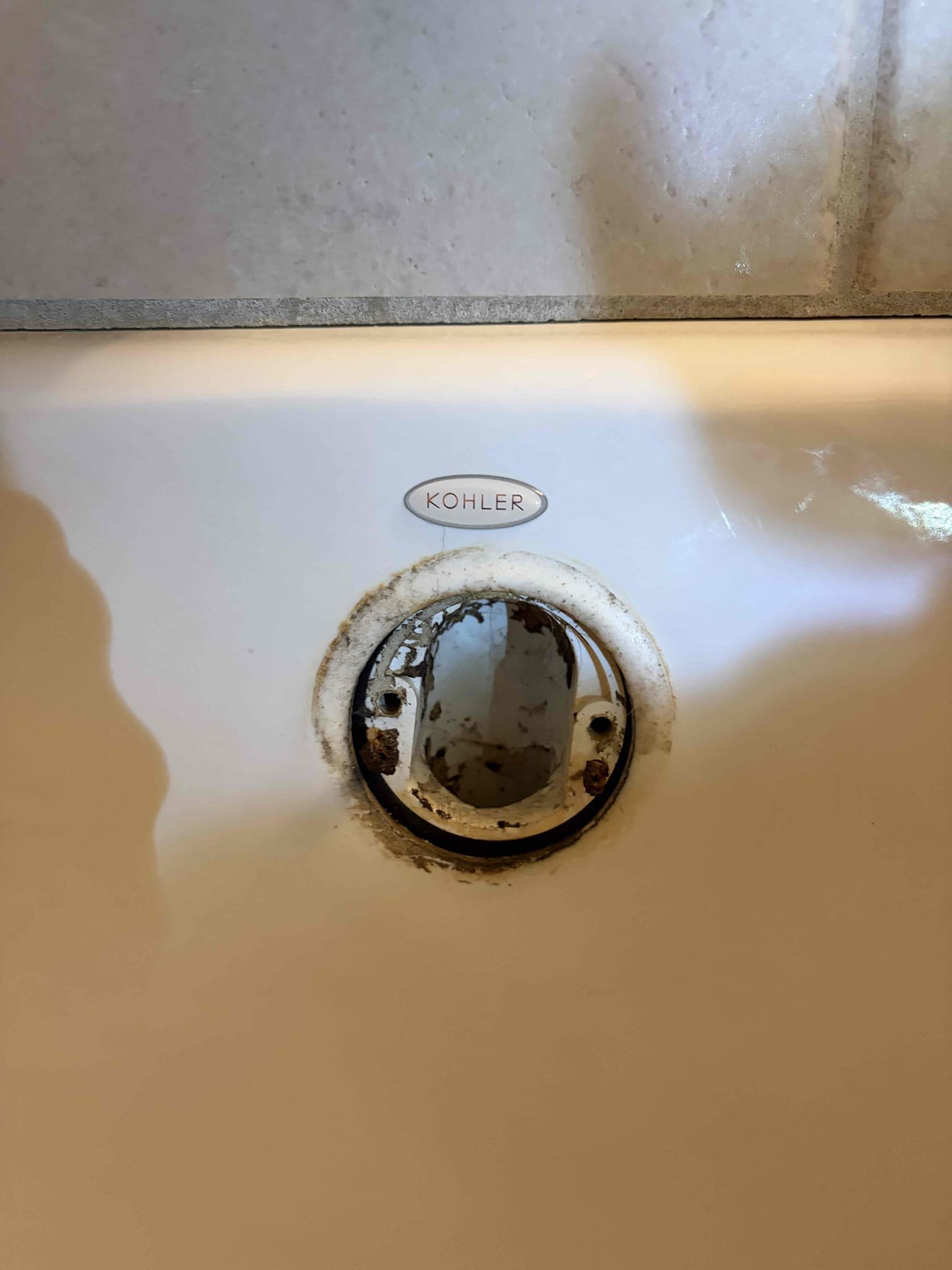 For this customer we came out to look at a wet spot in the ceiling of where the dining room is. The wet spot looks like it has been therefore a while but progressively had gotten worse. The spot started about 6 months ago. I took a look in the bathroom, there are two young children that splash and play in the tub above where the spot is. I took a look ay the tub spout to see if there was coming into the back of the spout and I couldn’t see any water there. Additionally I looked under the sinks and the toilet to see if there were any leaks. There are multiple grout cracks around the tub and the tile, this is indicating that when they are playing in the tub, water splash’s on to the floor and then goes down and creates that wet spot. I popped off the over flow cover to look at the seal. The seal doesn’t appear to be dry rotted or damaged. water pressure is normal. Did not look at heater. At this time I provided an estimate for removal of the drywall below in the dining room to find out w