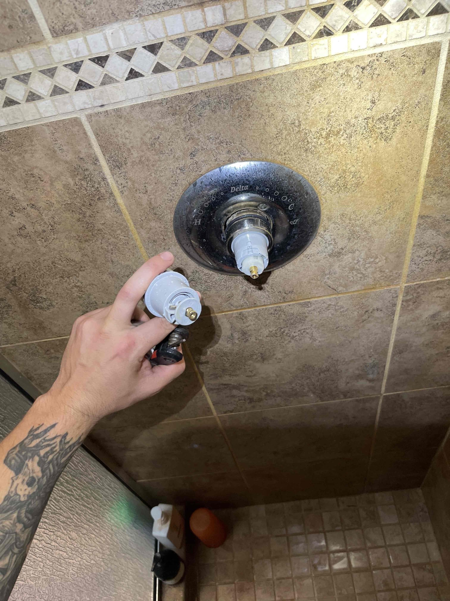 Came out for a dripping shower. Water pressure tested at 50 psi. Cartridge was a grey delta single handle shower cartridge. Received approval to swap the cartridge. Shut down water to the home and drained. Removed old cartridge and installed new one. Adjusted scald protector. Pressurized home to test for leaks. Tested to ensure proper function of the new cartridge. 1 year parts and labor warranty for cartridge only. Water heater is from 2001 and is  still operational. Emailed quote to replace tank if the homeowner ever needs it. No further issue at this time. 