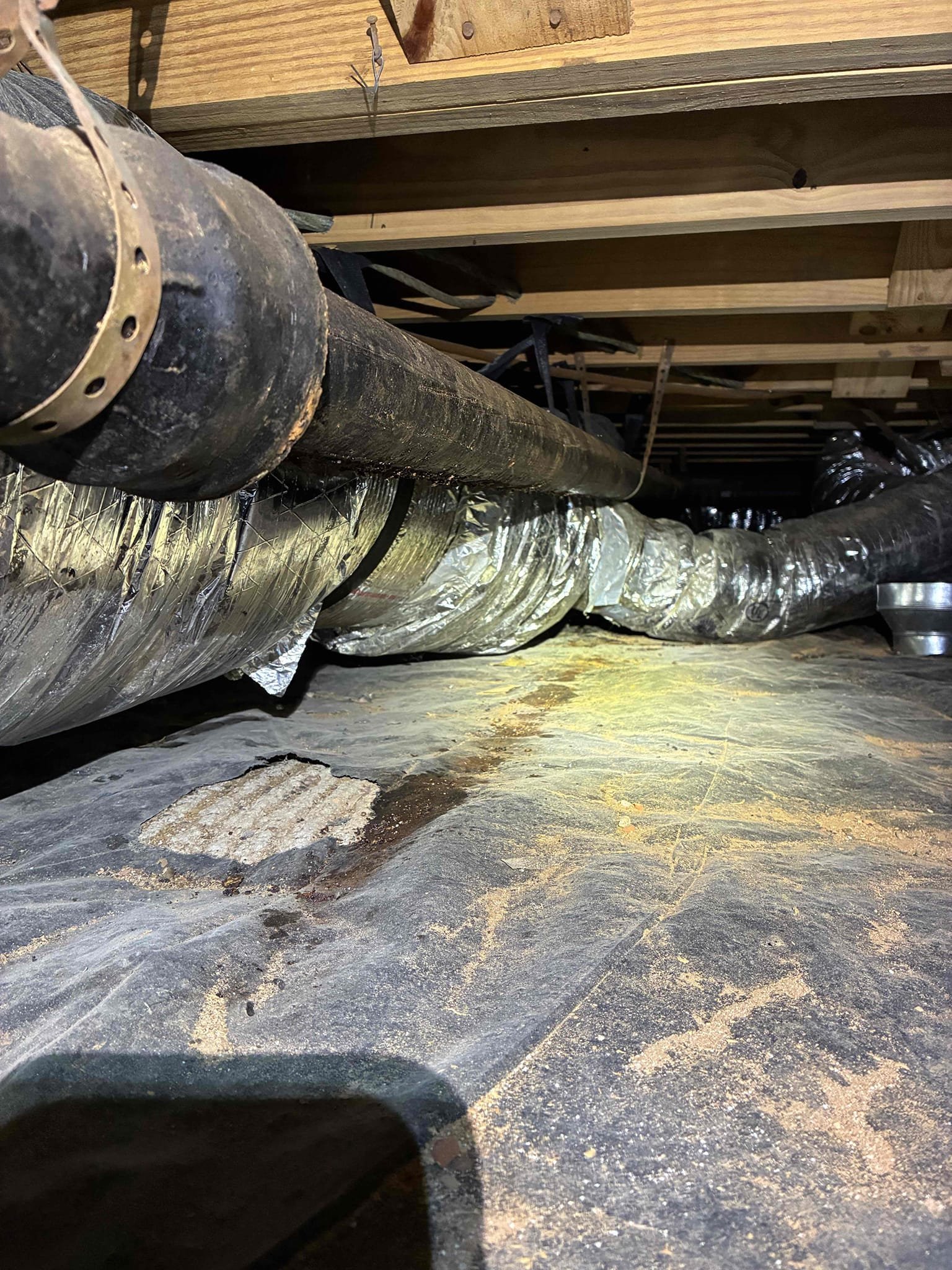 Found cast iron 3” drain for kitchen sink has multiple hole in it. Cut out 3” cast iron drain in crawl space serving kitchen sink. Ran new 3”pvc drain serving kitchen sink and connected 2” cast iron washing machine drain into new 3” pvc drain. Ran water to test and left in good working order.