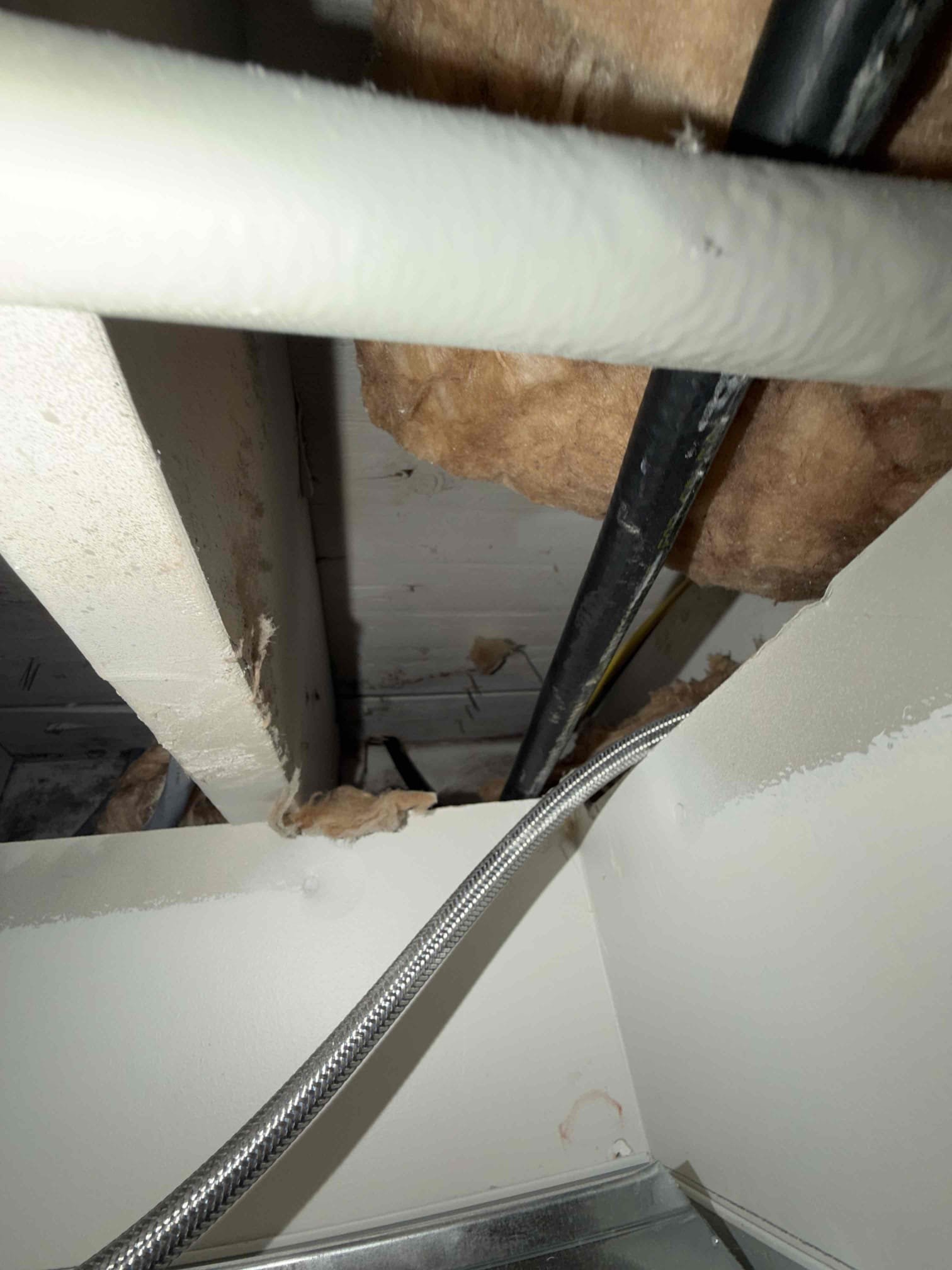 Shut gas off to home. In utility closet rework gas piping and added tye in for track pipe. Behind stove cut and drilled wall. Finished up trac pipe. Made all gas connections and turned gas back on. Tested our connections and no gas leaks were present at this time. Also water heater was back one. Strapped pipe properly and cleaned up work area.