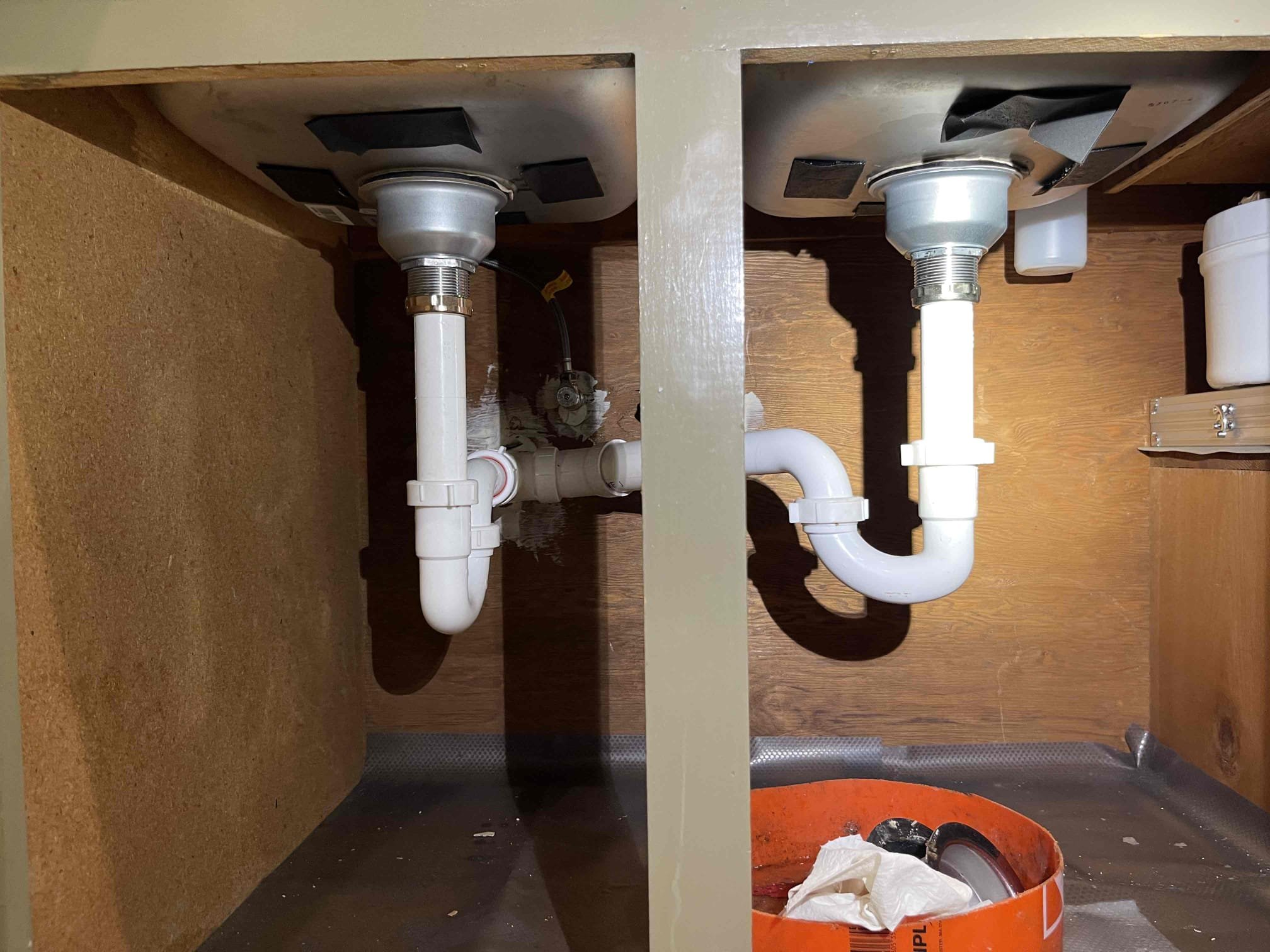 Came out for a loose faucet and a leak under the sink. Homeowner was able to tighten the faucet before we arrived. Tested the for the leak at the sink and found the right side strainer was leaking. Received approval to replace, and included the left side strainer as a courtesy. Replaced parts and tested to ensure a leak free installation and proper drainage. No further issue at this time. Water pressure tested at 50 psi.