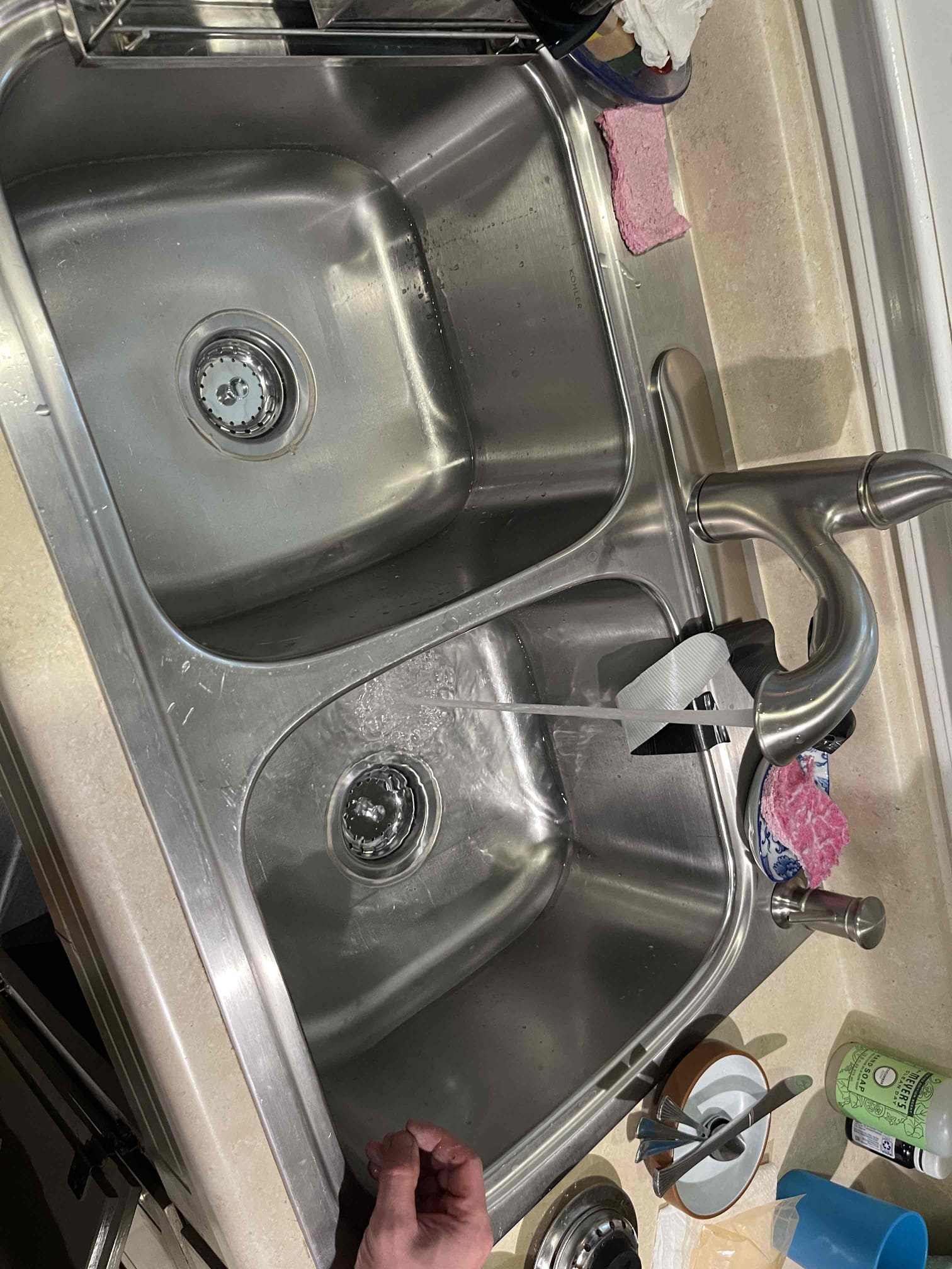 Came out for a loose faucet and a leak under the sink. Homeowner was able to tighten the faucet before we arrived. Tested the for the leak at the sink and found the right side strainer was leaking. Received approval to replace, and included the left side strainer as a courtesy. Replaced parts and tested to ensure a leak free installation and proper drainage. No further issue at this time. Water pressure tested at 50 psi.