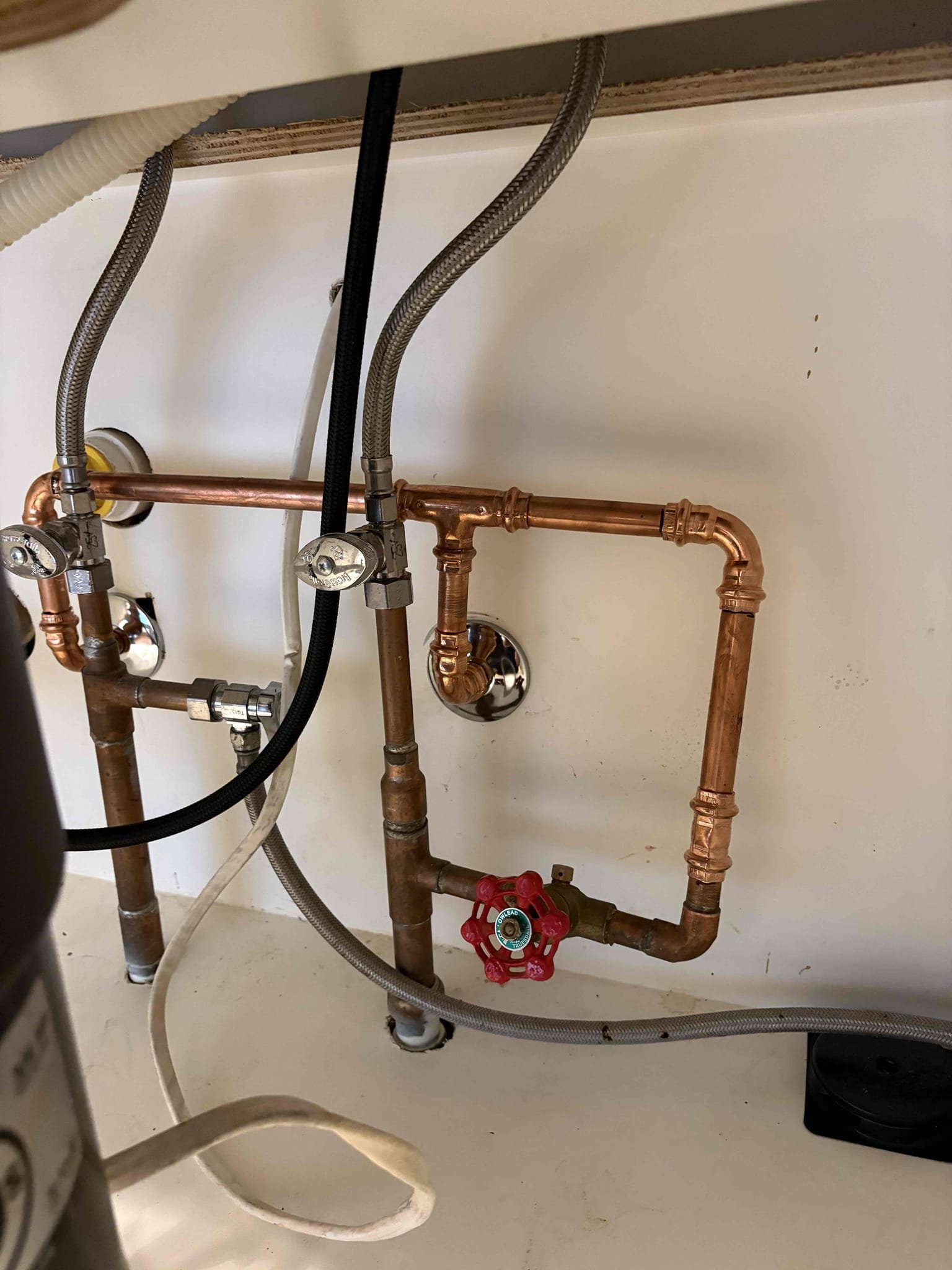 Remove existing tankless water heater on side of home and replace with new outdoor rated Navien 240A2. Will be running drop cord for power temporarily until homeowner can have an electrician come install a dedicated outlet.