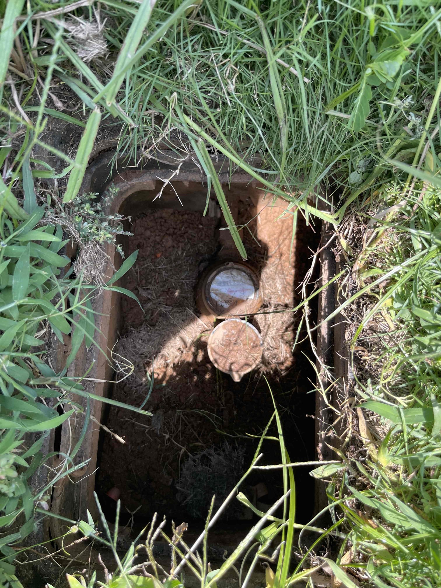 Came out for a leak in the yard. Confirmed at the meter there was a leak. Gave options for exploratory dig with repair or replacement. Customer approved us for exploratory dig of the water service to confirm it could be repaired. Dug up in yard and found leak on 1 inch pvc tee for irrigation. Notified home owner we could do repair on broken section. Left and purchased parts. Returned and cut out broken section and irrigation tie ins at home owners request and repipe the broken section. Allowed adequate time for the glue to cure before testing. Turned water back on and confirmed no leaks on repair. Meter stopped spinning once fully pressurized. Backfilled removed soil. One year warranty on repaired section only. * there was a misunderstanding on total price, due to language barrier.* 