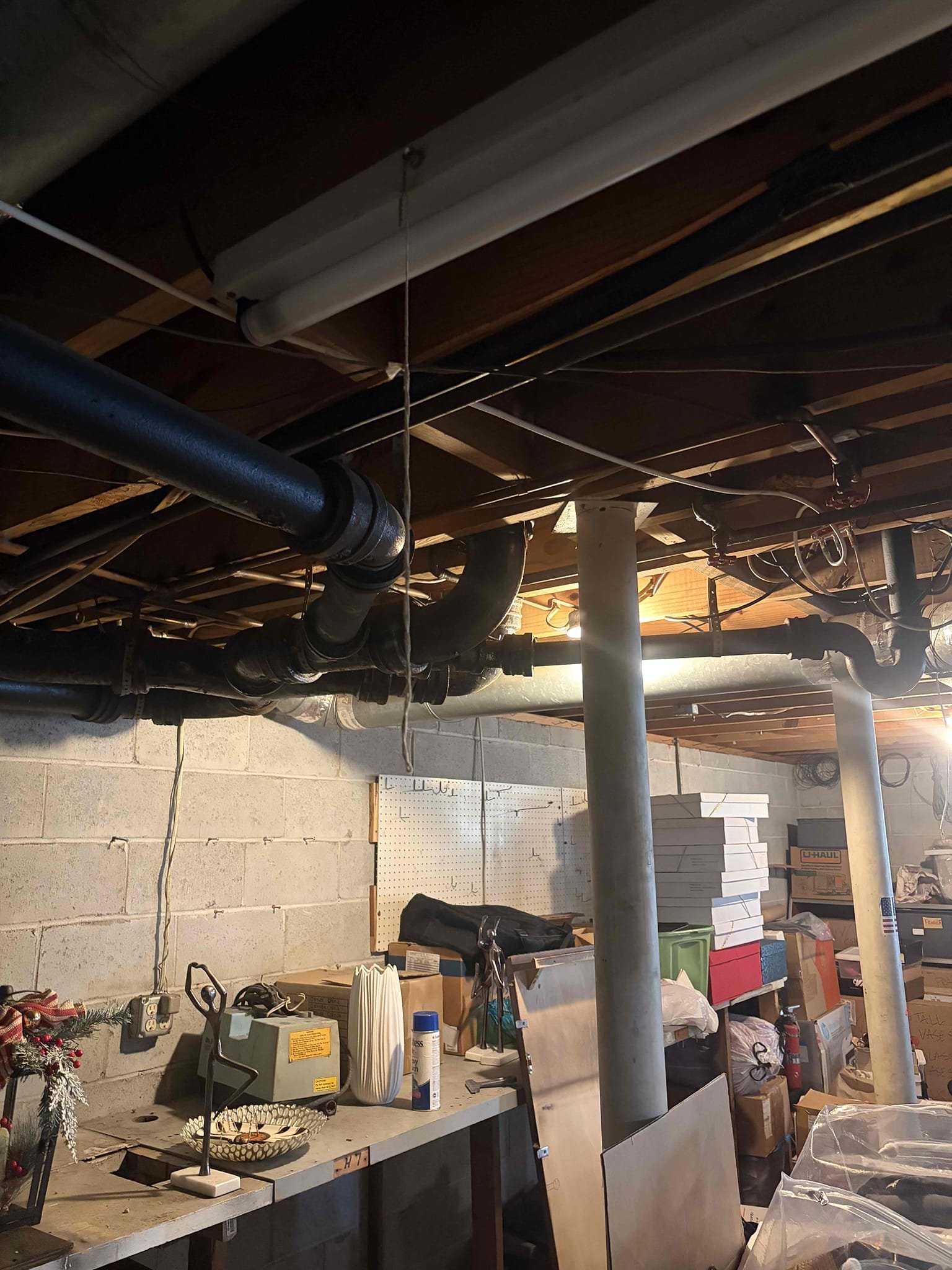 Upon arrival, customer stated she is experiencing a backup. After inspection, found clean out in basement. Pop clean out, clean out is not holding any water. Informed customer blockage is somewhere between cleanout and bathrooms. Informed customer I can run drain machine back through clean out and attempt to clear blockage. Customer approved estimate. Ran drain machine approximately 25 to 30 foot, cleared blockage. Blockage was caused by wet wipes. Also found leak coming from cast-iron combo wye, provided customer with estimate to re-pipe both bathrooms from cast-iron to PVC. Re-pipe will include two new closet flanges, tying onto existing tub and shower and vent and vanity. Customer signed up for Win With Chen!