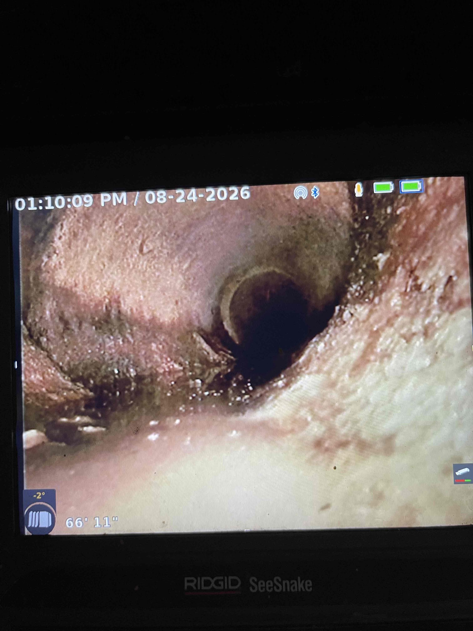 Came out for sewer scope. Opened cleanout in the basement. Ran camera all the way down to the city sewer. There is a city cleanout in the yard with a broken aSDR cleanout cap. Sewer line is orangeberg with multiple sections collapsing. Sewer line will have to be replaced. Waterline is in very close proximity to the sewer and was installed below the sewer line with no sleeve. Per code a water service must be sleeved if it is installed next to the sewer to prevent cross contamination of sewage with the fresh water. Water service will be damaged digging up the sewer line to replace it through the wall. Gave realtor on site the pictures and video of the inspection. 