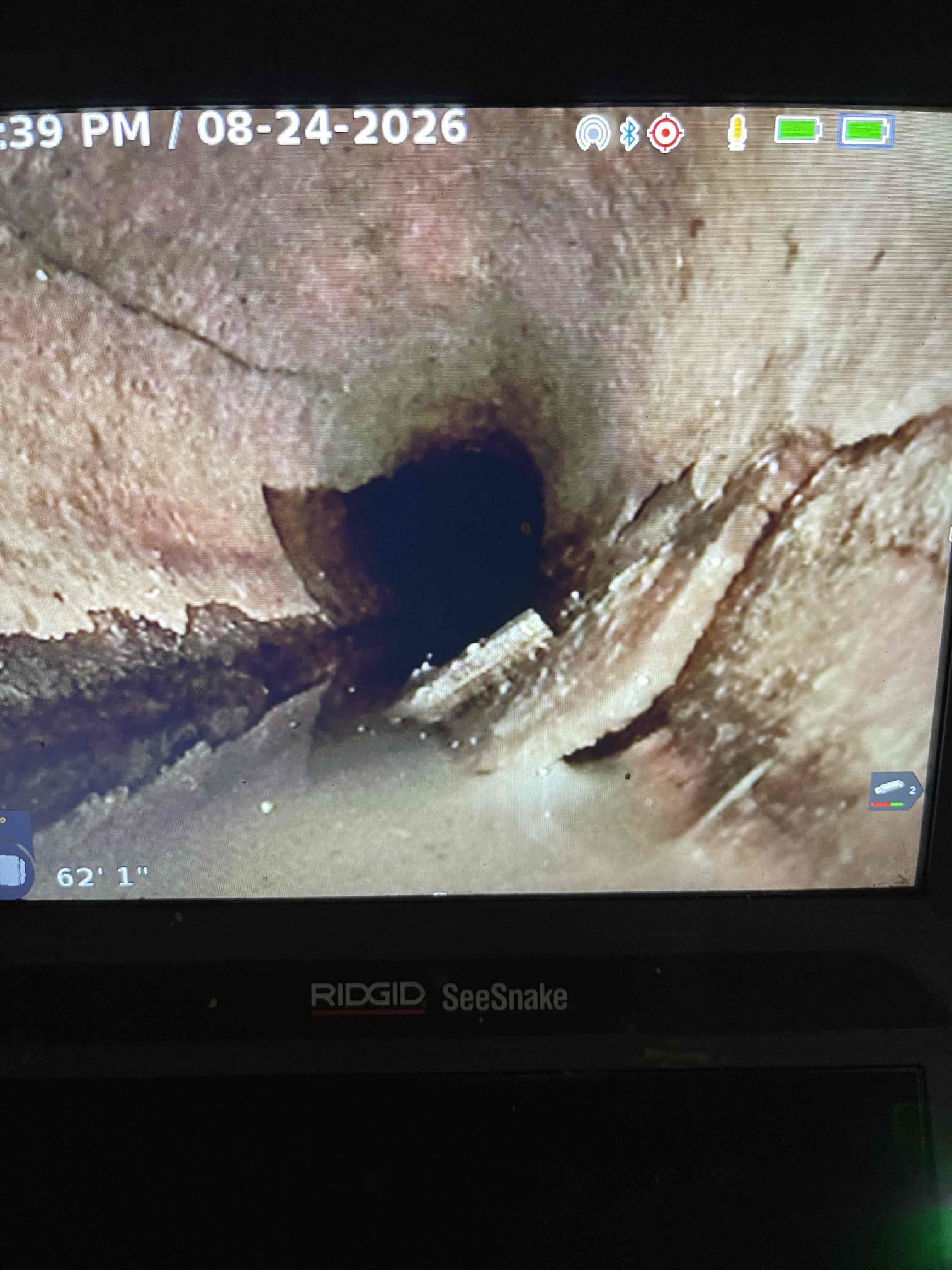 Came out for sewer scope. Opened cleanout in the basement. Ran camera all the way down to the city sewer. There is a city cleanout in the yard with a broken aSDR cleanout cap. Sewer line is orangeberg with multiple sections collapsing. Sewer line will have to be replaced. Waterline is in very close proximity to the sewer and was installed below the sewer line with no sleeve. Per code a water service must be sleeved if it is installed next to the sewer to prevent cross contamination of sewage with the fresh water. Water service will be damaged digging up the sewer line to replace it through the wall. Gave realtor on site the pictures and video of the inspection. 