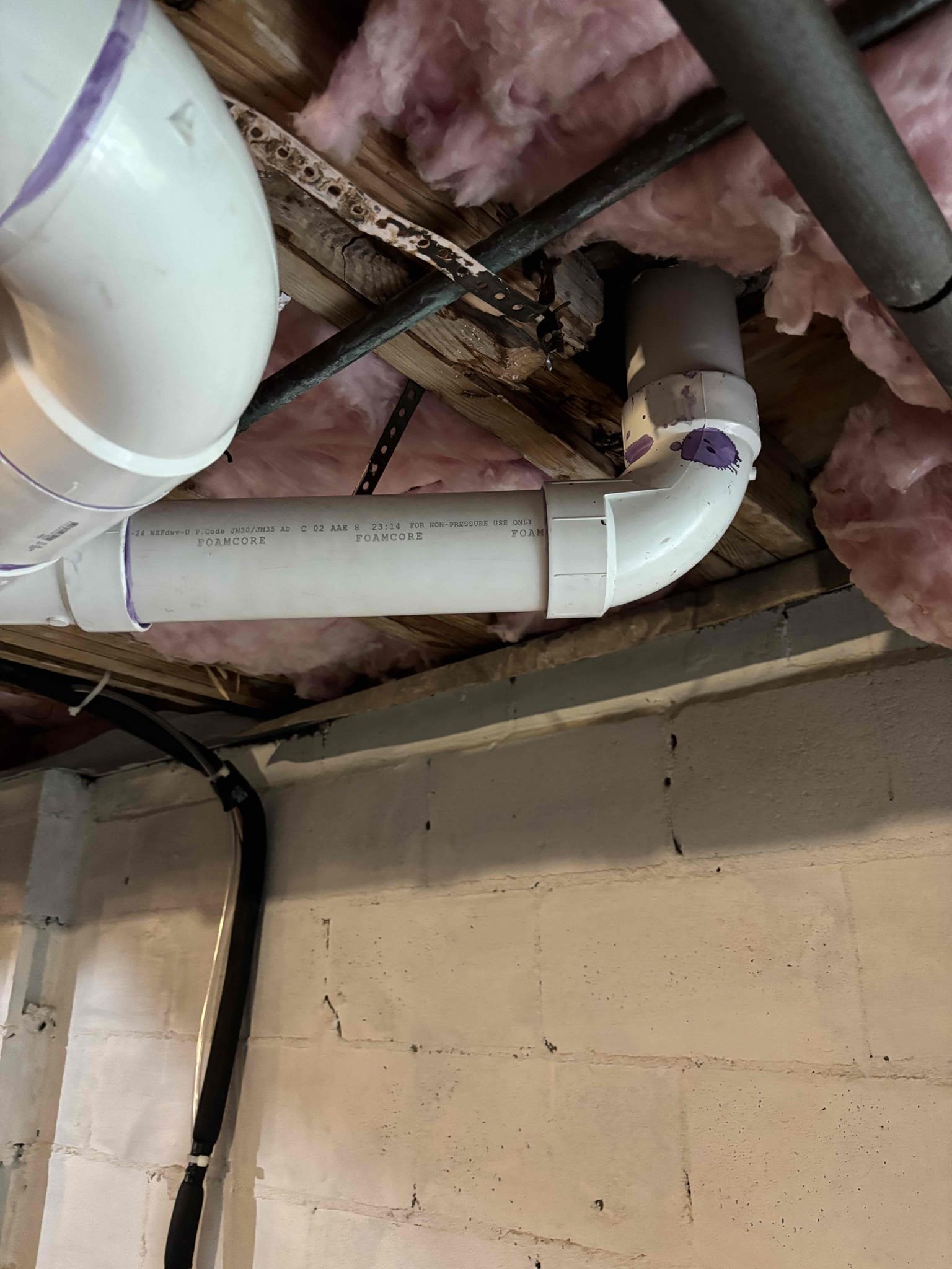 Returned to perform cast-iron re-pipe, re-piped, laundry room, kitchen, and main bathroom. Installed in all new PVC tied into mainline exiting home. Customer approved of height for drain line. Also install installed new flange for toilet. No leaks at departure. All drains are draining properly at departure.