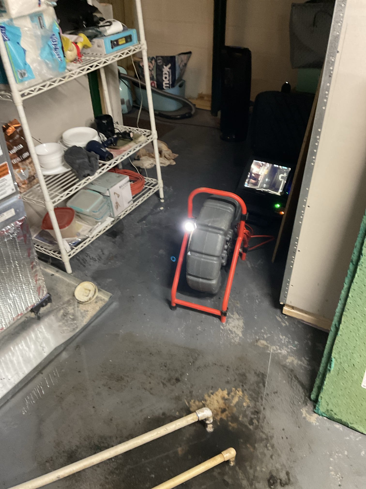 Cleared floor drain in front of the water heater , camera scope the line found back up is in old cast iron pipe , quote pump and reroute line to existing pvc 