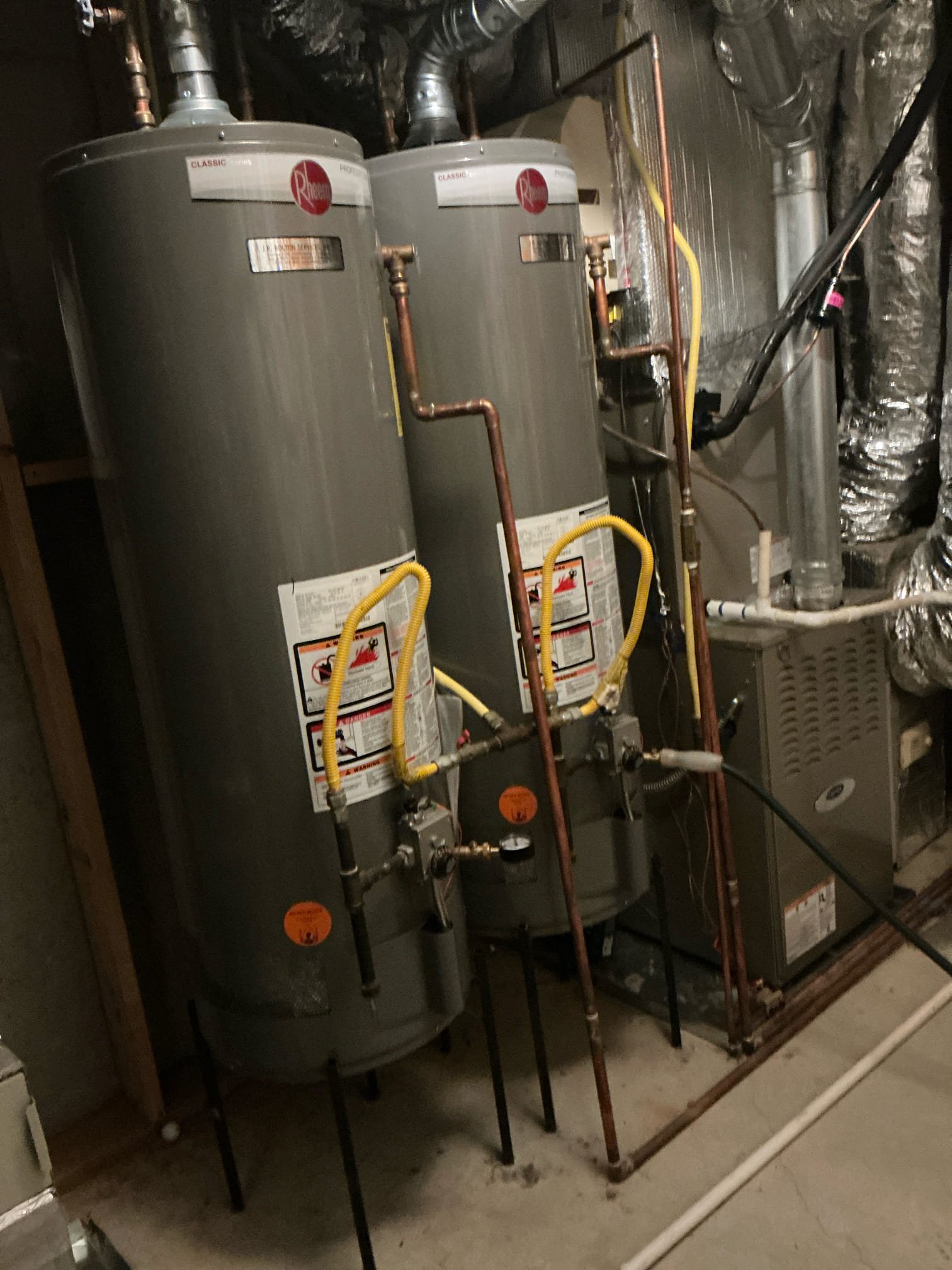 Found water pressure at 115 psi and both gas water heater are over 16 years old. Leak on outside of house is appears to be on the irrigation system. Turned irrigation system off will keep check to insure. Removed Prv and installed new prv and set pressure at 60 psi. Removed two water heaters from stands. Installed two new 50 gallon natural gas rheem water heaters in new water heater pans. Repipe water lines to water heaters so that the water heater operate parallel. Tagged all valves. Tested and left in good working order.
