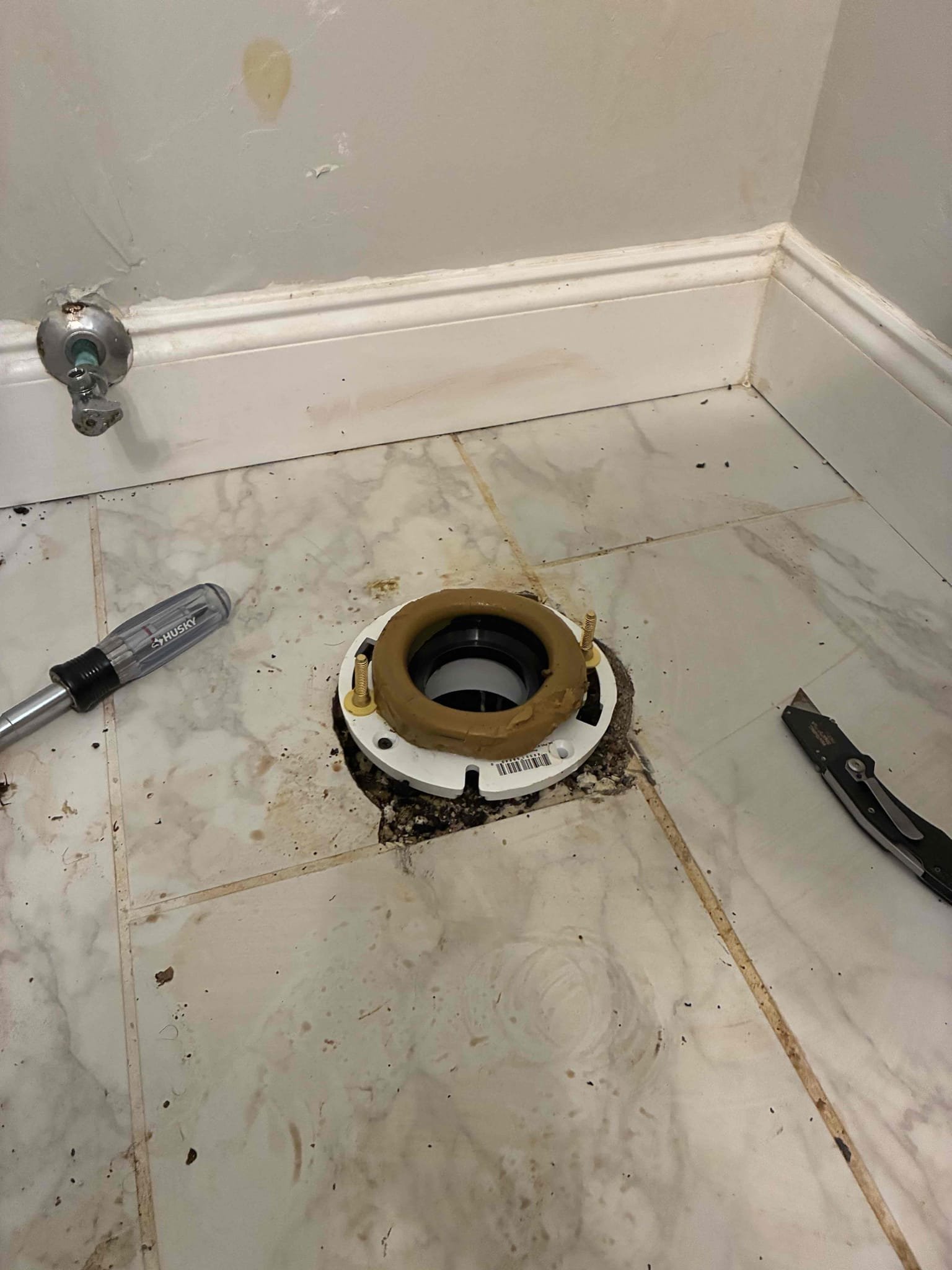 Pulled toilet and found flange broken. Attempted to repair and could not. Replaced toilet flange and reset toilet. Flushed several times to test. Caulked toilet to floor and left in good working order.