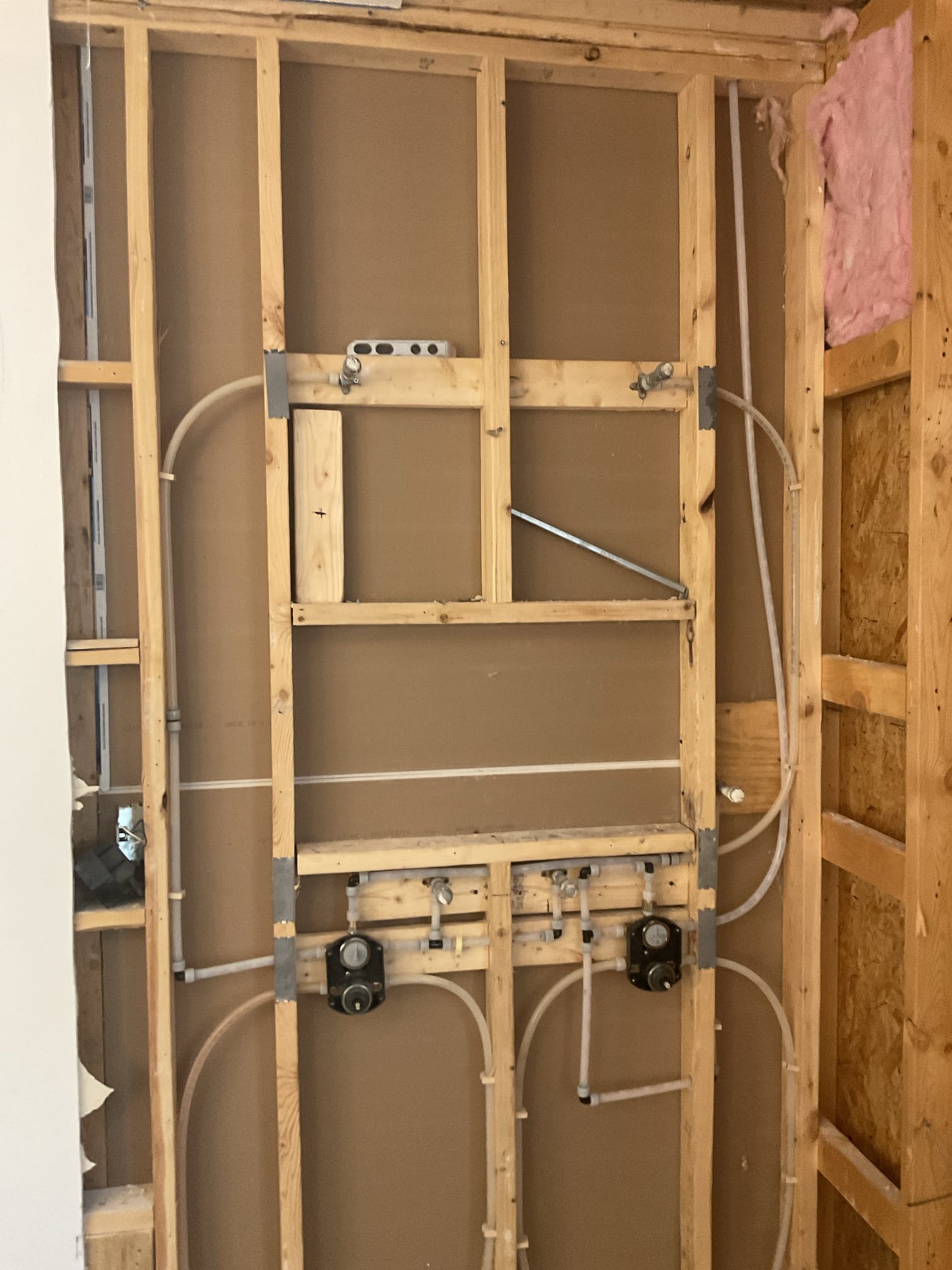 Replaced two single function delta shower valve , installed customer supplied two delta rough in valves with build in diverter for two reg shower head , a rain head in the ceiling, two body sprays , and one handheld shower. 