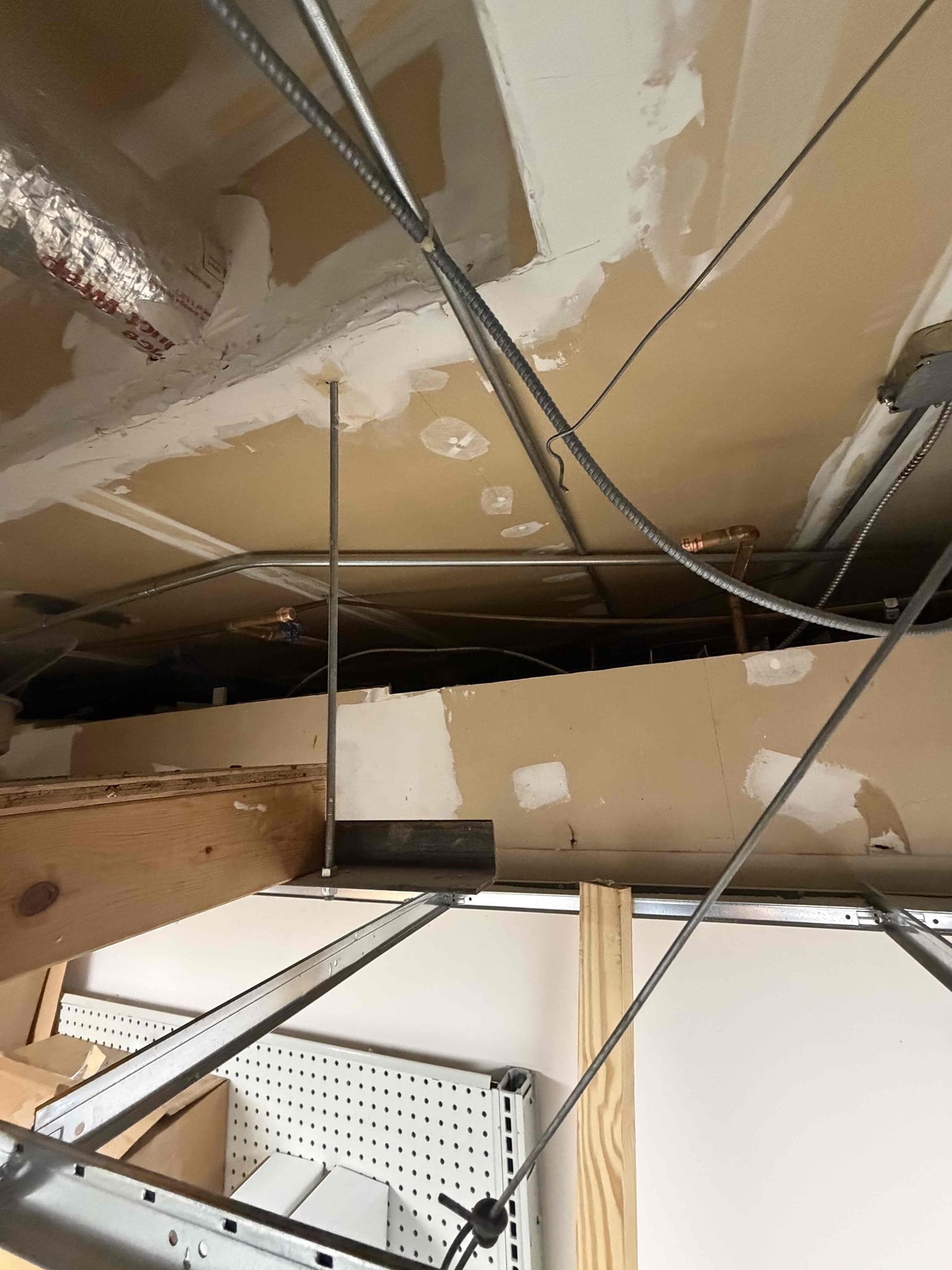 Replaced failed 6 gallon point of use water heater with an under sink point of use instant water heater. Removed existing water heater from ceiling. No leaks at departure. Capped old water lines.