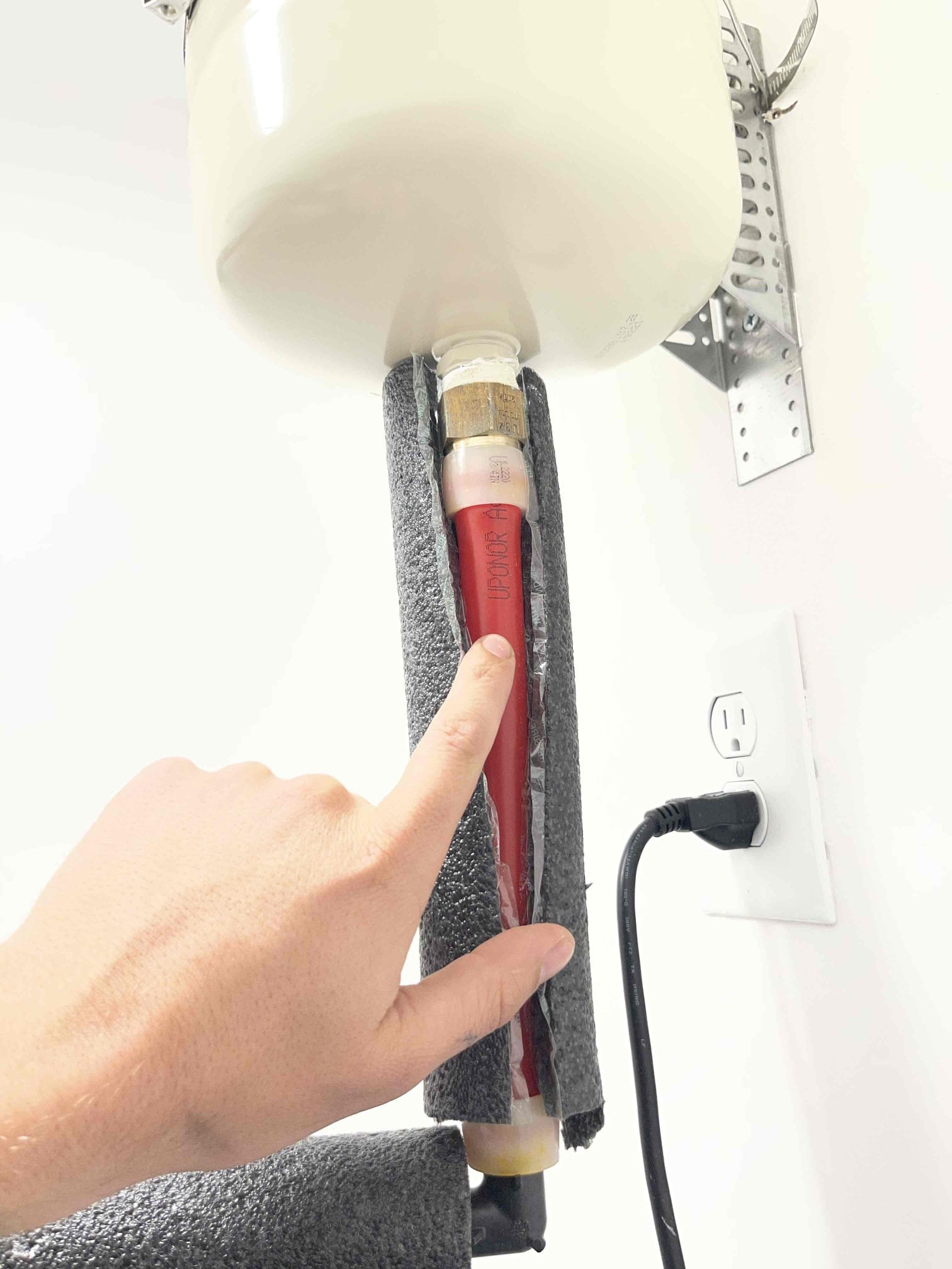 Came out for a smell by the water heater. Came out and assessed the water heater. They only smelled the foul smell randomly when they were walking upstairs past the water heater closet. We found there was a condensate trap in the closet for the t&p drain that had no trap primer. The water had evaporated and is allowing sewer gas to come up out of the pipe. I used a cup and filled the trap back up. Left quote to install trap primer inside the closet to keep the p trap full. We also found customer has the recalled colored uponor piping that is prone to pinhole leaks. House is only 6 years old and this recalled material is prone to pinholes and system failure around the 10 year mark. Left quote to install a whole home flood prevention system. Static pressure on the home is 40 and dropping to 10-15 psi when 1 toilet is flushed. Left quote for new PRV as well. 