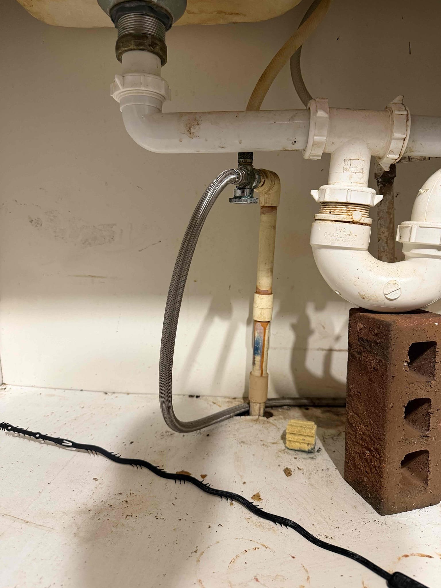 Upon arrival, customer states they’re experiencing a leak coming from cpvc crack. Noticed crack in 3/4 cpvc coupling. Recommend replacement of cracked coupling and stop. Customer approved estimate. Installed cpvc to pex adapter and installed new angle stop. Tested system, no leaks at departure. Also could not replace supply line due to corrosion on faucet.