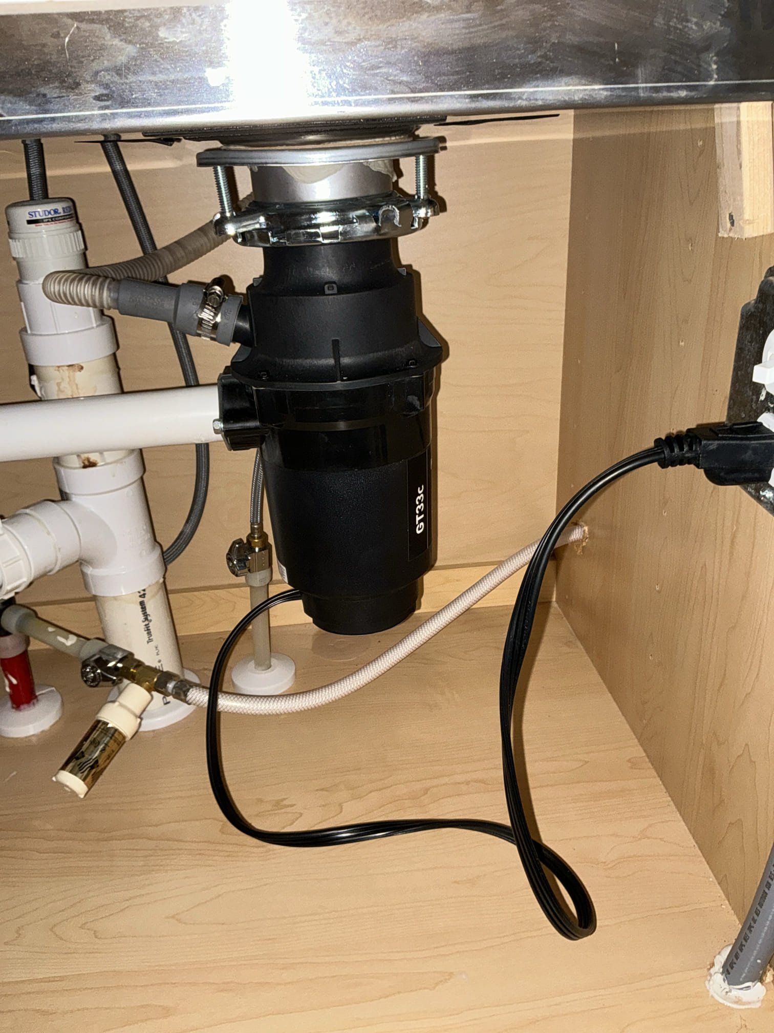 Diagnosed garbage disposal not working properly. Customer had already purchased new disposal. Removed old moen disposal, installed and connected new moen disposal provided by customer. Tested new disposal for proper operation and leaks, no issues or leaks found with new disposal after work completed. 

Checked water heaters and water pressure both are good.