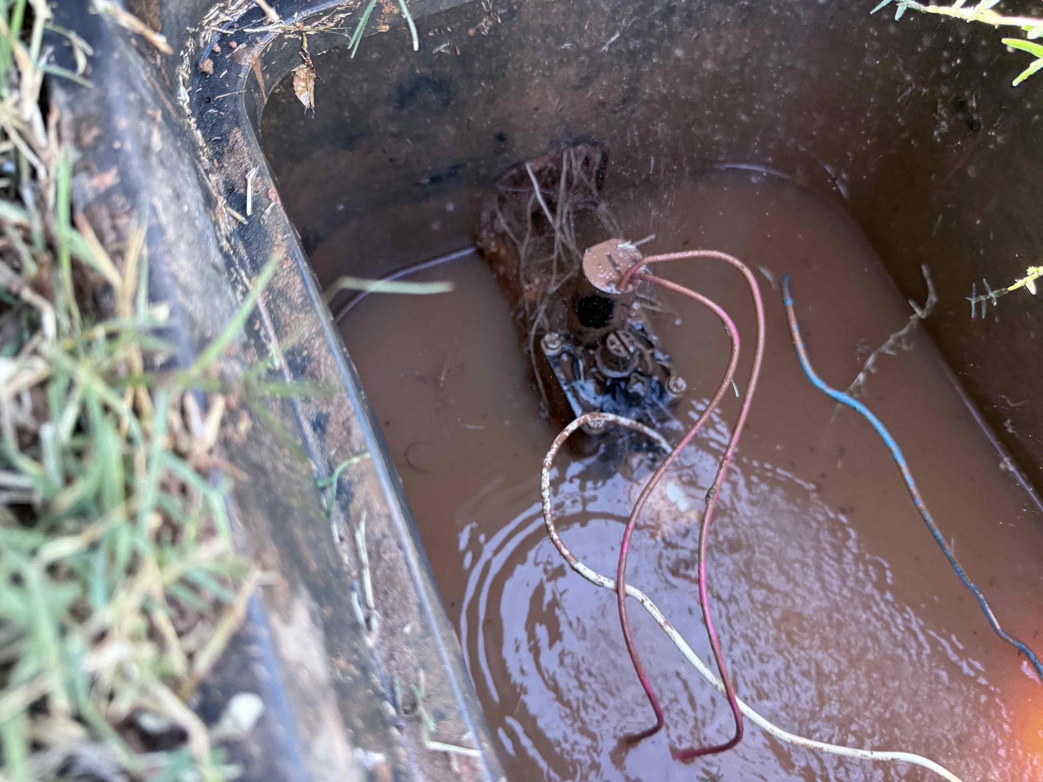 Upon arrival customer had a high water bill. I shut of main shut off valve inside the home and the meter was still spinning and full of water. Gave customer estimate to do an exploratory dig to attempt to find leak. Customer approved estimate. Dug up by meter and irrigation control box after digging and pumping water out of boxes I saw the irrigation control valve  spraying water from the top. I shut water off to irrigation from ball valve inside the box. Recommend customer to call irrigation company. Meter no longer spinning upon departure 