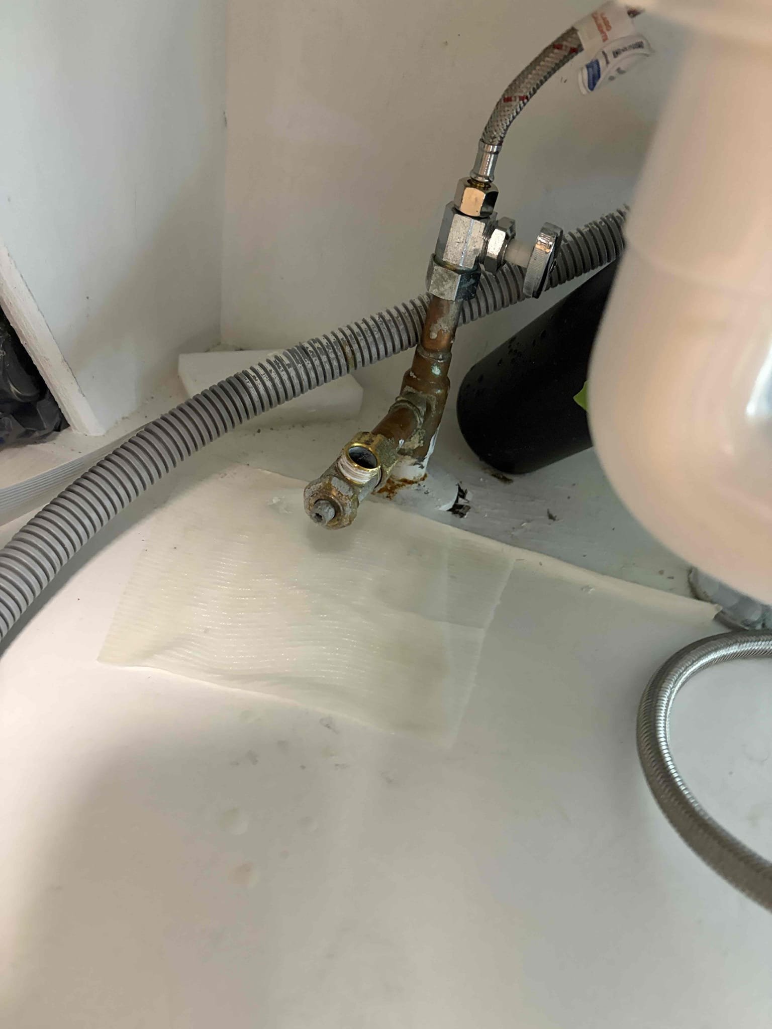Replacement of one service stop valve for the dishwasher line
Upon arrival, I inspected the service stop valve and determined that the existing valve was an old-style compression, multi-turn valve that needed to be replaced.

The customer was also attempting to connect a dishwasher. The existing 3/8” compression connection did not match the dishwasher’s 7/8” connection. To complete the installation, either an adapter/speedy valve would have been required or the existing valve would need to be replaced with a new 3/8” compression stop valve. I installed a brand-new 3/8” compression stop valve to complete the plumbing portion of the project.

During the inspection, I also noted that the water heater is approximately 15 years old, with a manufacturer date of 2011, and is approaching the end of its expected service life. An estimate was provided to the homeowner for replacement of the water heater.

Additionally, while attempting to install the dishwasher, the customer applied Teflon tape 