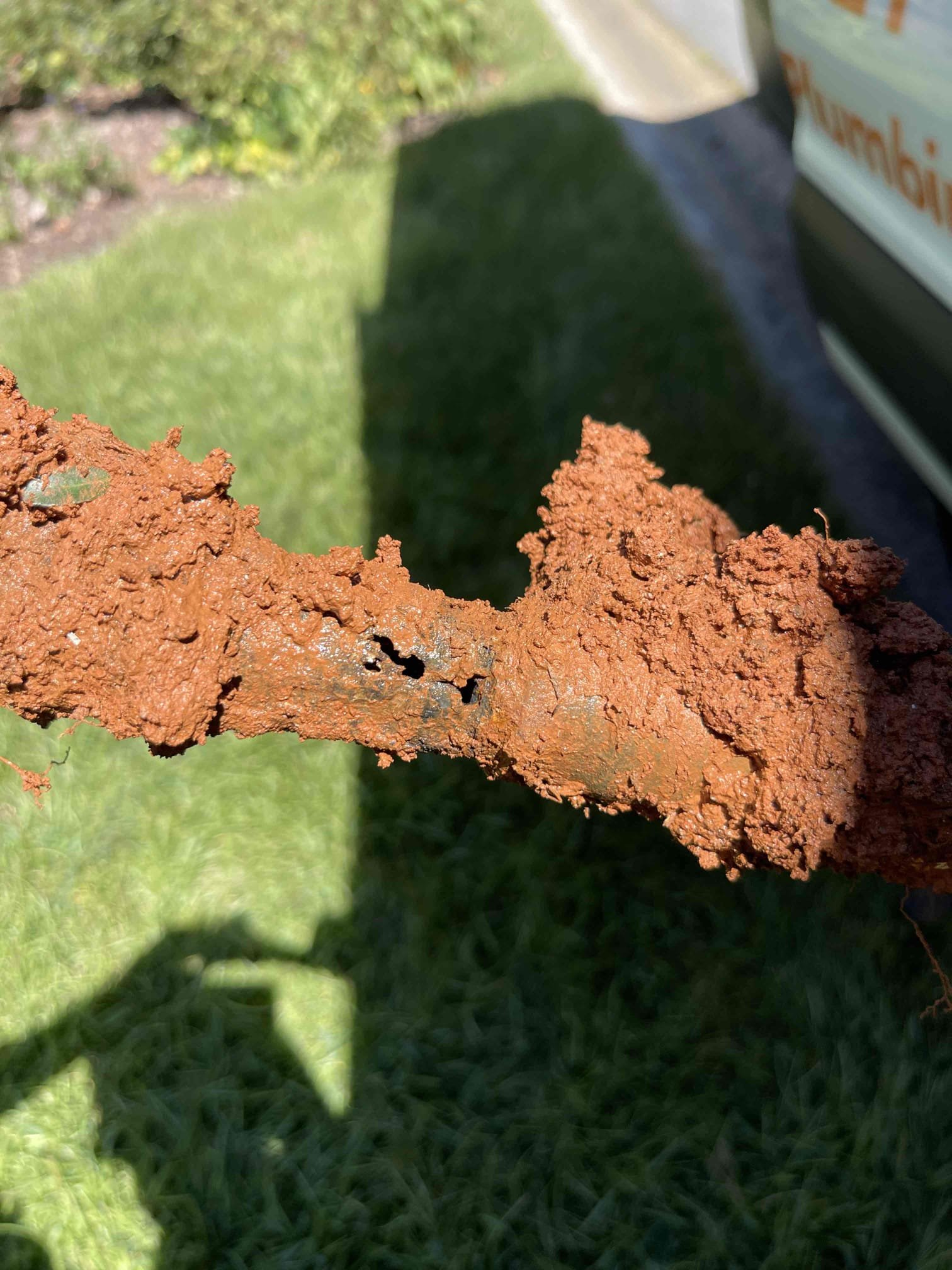 Came out for a leak in the yard. Homeowner already had the county out who confirmed it was on the customers side of the meter and shut the water off for them. We arrived and met with the homeowner who directed us to the meters location. We turned the water on at the curb stop and found water was flowing into the meter box immediately. We received approval to dig up the line and assess what was leaking. Dug up the area in front of the meter and found the water service had been replaced, but they left a galvanized steel stub out about 1’ long coming out of the meter that had blown out on the bottom side of the pipe. Leak was not caused by roots as the homeowner suspected. We removed the galvanized pipe and meter coupling all the way back to the pvc pipe. Replaced the removed section with a new brass meter coupling, and pex back to the pvc. Allowed adequate time for glue to fully cure before testing. Tested repair and confirmed proper flow and a leak free installation. Confirmed no other 