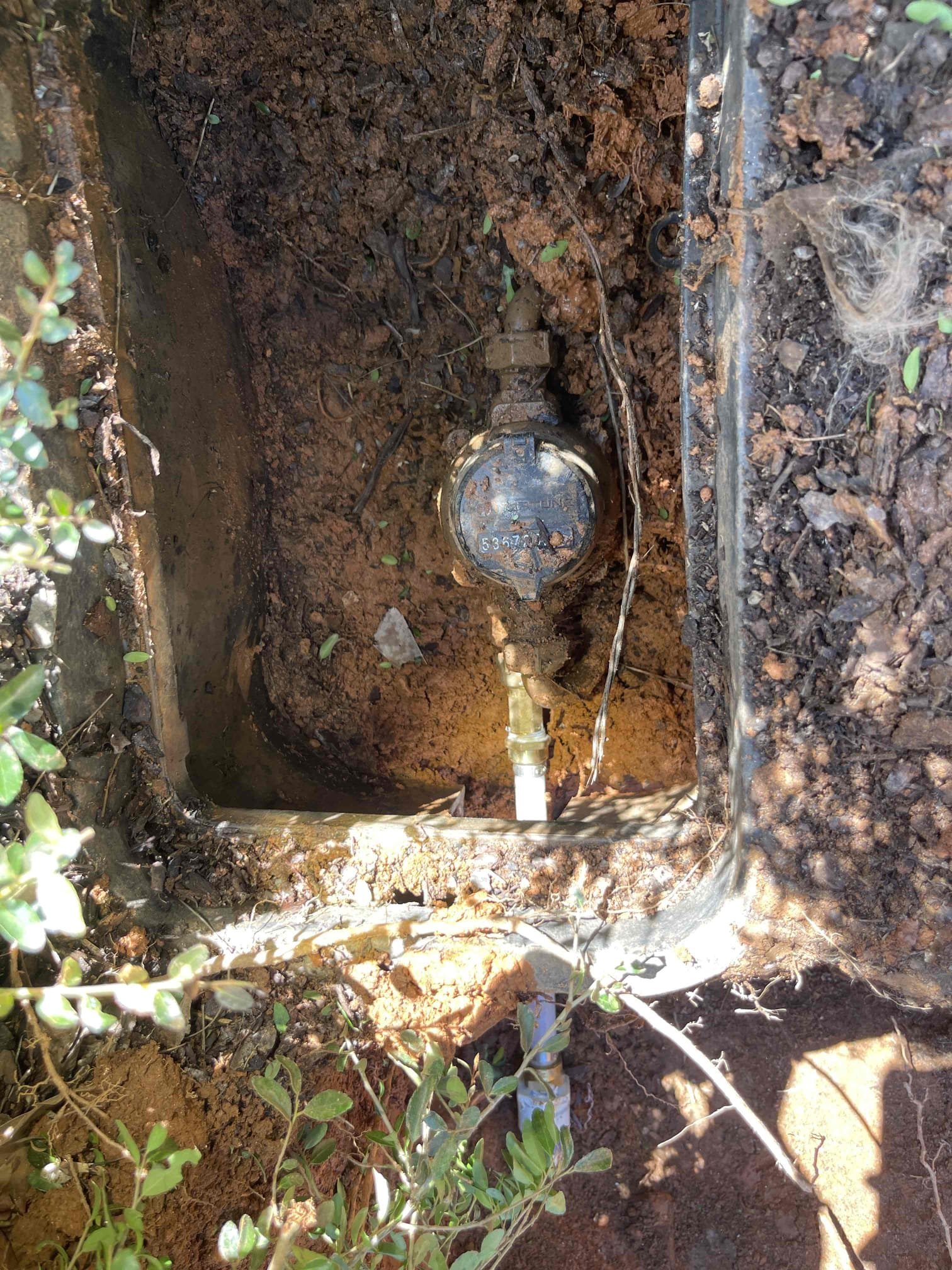Came out for a leak in the yard. Homeowner already had the county out who confirmed it was on the customers side of the meter and shut the water off for them. We arrived and met with the homeowner who directed us to the meters location. We turned the water on at the curb stop and found water was flowing into the meter box immediately. We received approval to dig up the line and assess what was leaking. Dug up the area in front of the meter and found the water service had been replaced, but they left a galvanized steel stub out about 1’ long coming out of the meter that had blown out on the bottom side of the pipe. Leak was not caused by roots as the homeowner suspected. We removed the galvanized pipe and meter coupling all the way back to the pvc pipe. Replaced the removed section with a new brass meter coupling, and pex back to the pvc. Allowed adequate time for glue to fully cure before testing. Tested repair and confirmed proper flow and a leak free installation. Confirmed no other 