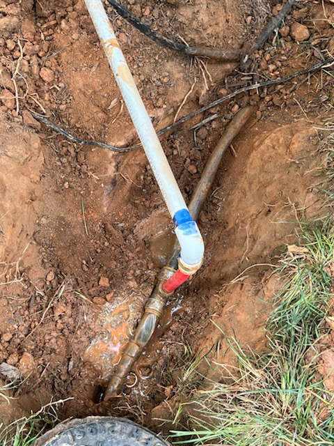 Fixed kinked copper pipe next to water meter , installed shut off valve for irrigation system 