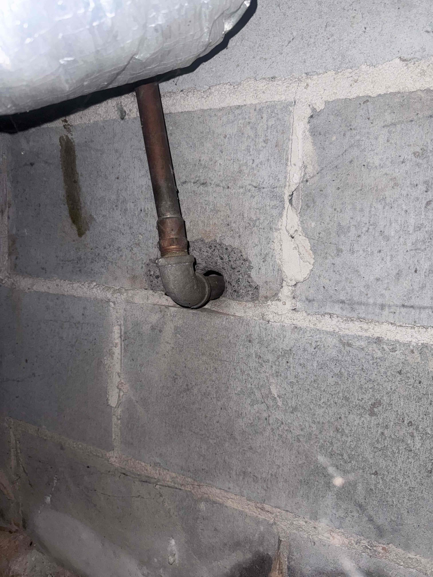 Upon arrival, the customer reported a sewer line leak and requested an estimate to replace the existing galvanized water service line. After evaluating the plumbing system and discussing the available options with the customer, I recommended replacing approximately 60 feet of cast-iron drain piping in the crawl space. I also proposed replacing the existing water service with a new 1-inch PEX line to provide adequate water volume, along with installing a new water service stub-out on the side of the home, as the existing line runs beneath the concrete porch. During the evaluation, I also observed that the existing water heater was approximately 10 years old and that the water supply line feeding the unit had been reduced from 3/4-inch to 1/2-inch. I informed the customer of the water heater's age and the need to address the existing installation to meet applicable code requirements. I recommended replacing the existing unit with a new 50-gallon tall natural gas water heater. The custome