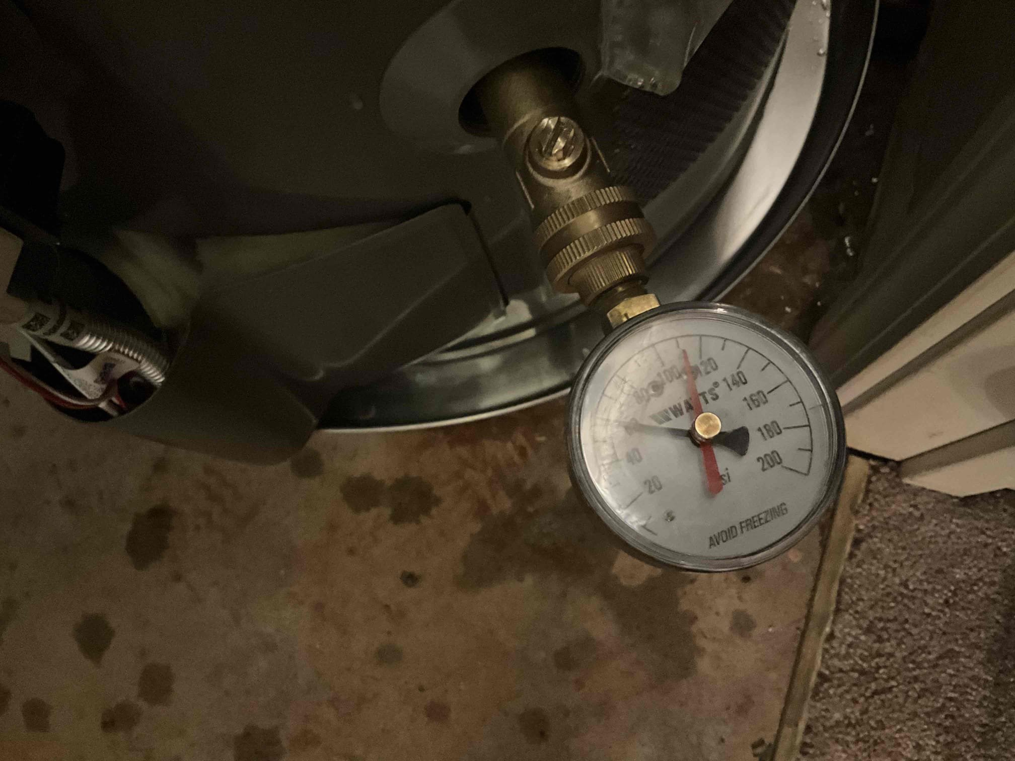 Upon arrival, the customer reported a leaking pipe near the water heater. After performing an evaluation, I identified an active leak at the existing pressure-reducing valve (PRV) and confirmed that the water heater was also leaking. The existing water heater was approximately 16 years old and required replacement. I explained my findings to the customer and recommended replacing both the water heater and the leaking PRV. I also recommended replacing the main water shut-off valve and making the necessary installation upgrades to bring the water heater system into compliance with applicable plumbing codes. The proposed work included installing a new thermal expansion tank secured with a mounting bracket, placing the new water heater inside a metal drain pan, and installing a new PRV and whole-home shut-off valve. The customer reviewed and approved the estimate. I removed the existing water heater and leaking PRV. I then installed a new 40-gallon tall natural gas water heater, a new ther