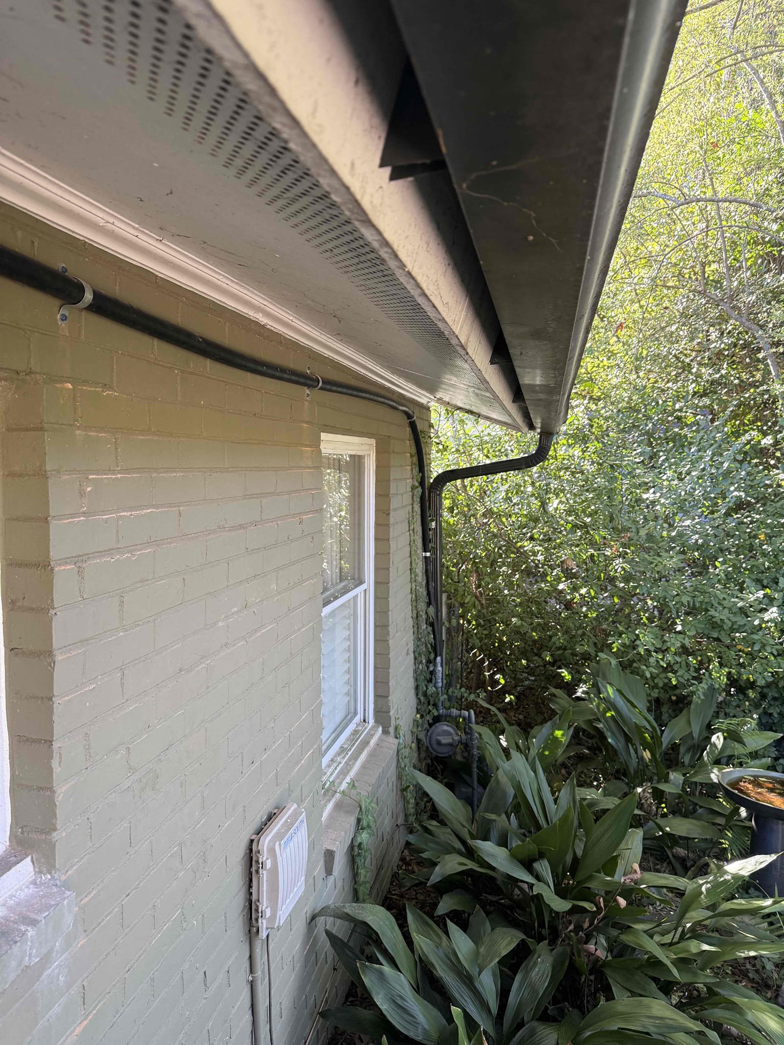 Returned to run new gas line and connect to hvac and back to original gas line entering the house. Installed 1 inch Trac pipe against the wall of the back of the house. Customer requested we run it along the brick. Stubbed new line up into attic for hvac system. Stubbed out 1/2 inch line for future outdoor grill. Supported gas piping every 3-5 ft, customer stated he was going to add more straps later on to straighten it out just a little more. Turned gas back on to check for leaks and found in leaks. Fired water heater up as a courtesy for the customer. Painted all exposed gas line that was not covered. Gas is on, customer will have hot water in 45 minutes to an hour. No leaks upon departure 