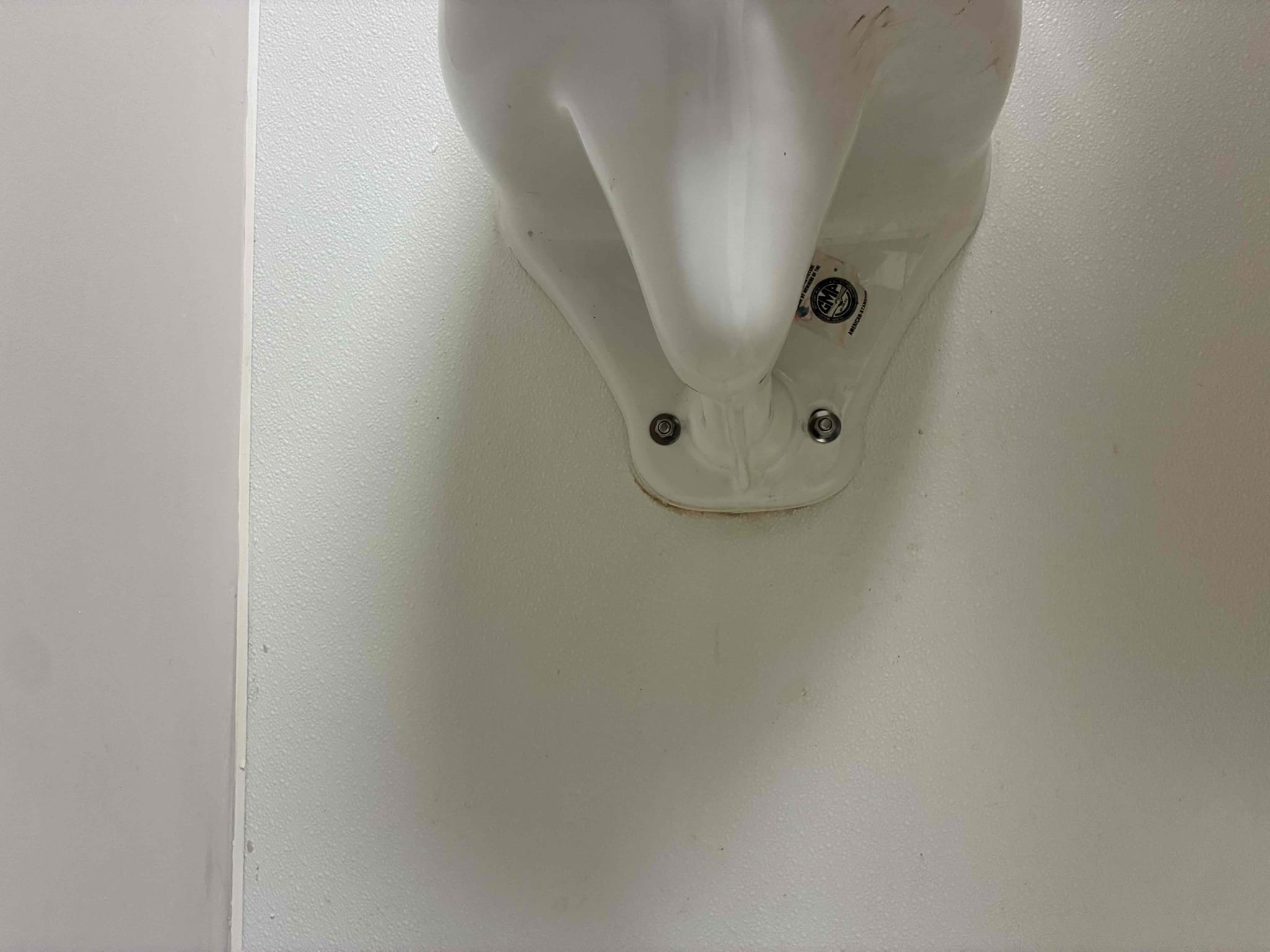 Upon arrival, customer stated leak coming from wall near men’s bathroom. Customer stated work had been done before on urinals and that there was no current leak in bathroom after approval cut wall to further determine leak source found wetness towards urinals from backside. Flushed urinal to determine leak coming from gasket/flange of urinal. Removed urinal and determined flange was broke. Removed old flange and installed new with new gasket, mounted urinal to wall secured and caulked. flushed several times to check for leaks and proper function.