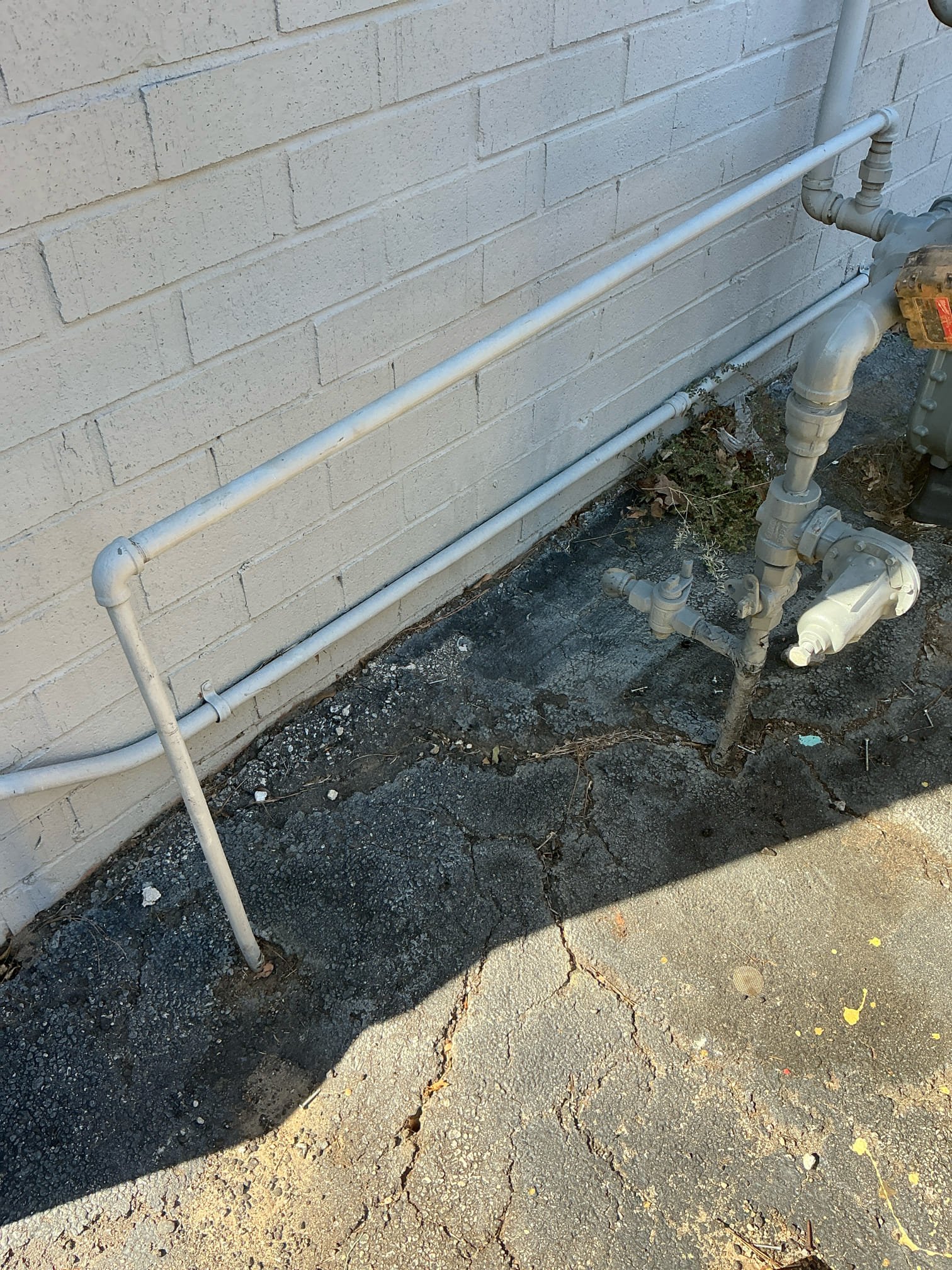 Found leak on exterior gas line going into asphalt. Cut gas line down to asphalt and capped gas off. Customer does not know where it could go. Customer will call if a new line is needed. Lit water heater upon completion. Tested and left in good working order.