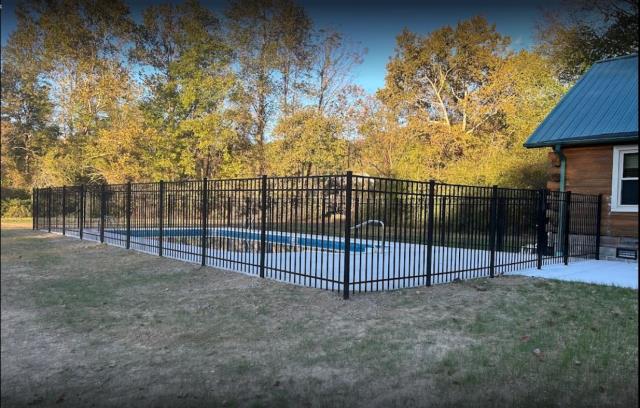 Dayton, TN - Stellar Black Aluminum Pool fence really stands out against the backdrop of fall colors in Dayton, TN! This sleek design brings beauty and style against the landscape, making a bold statement while keeping the pool secure. With its modern finish, it not only looks great but also provides a reliable barrier.