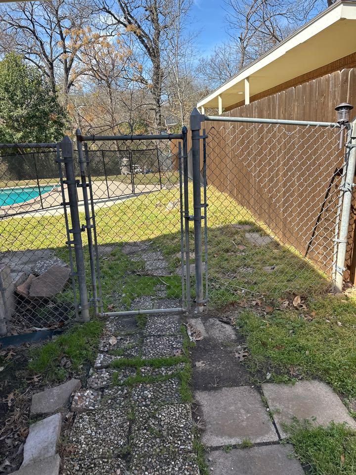 Dallas, TX - Installing a new cedar board on board fence with top cap and trim in replacement the chain-link fence